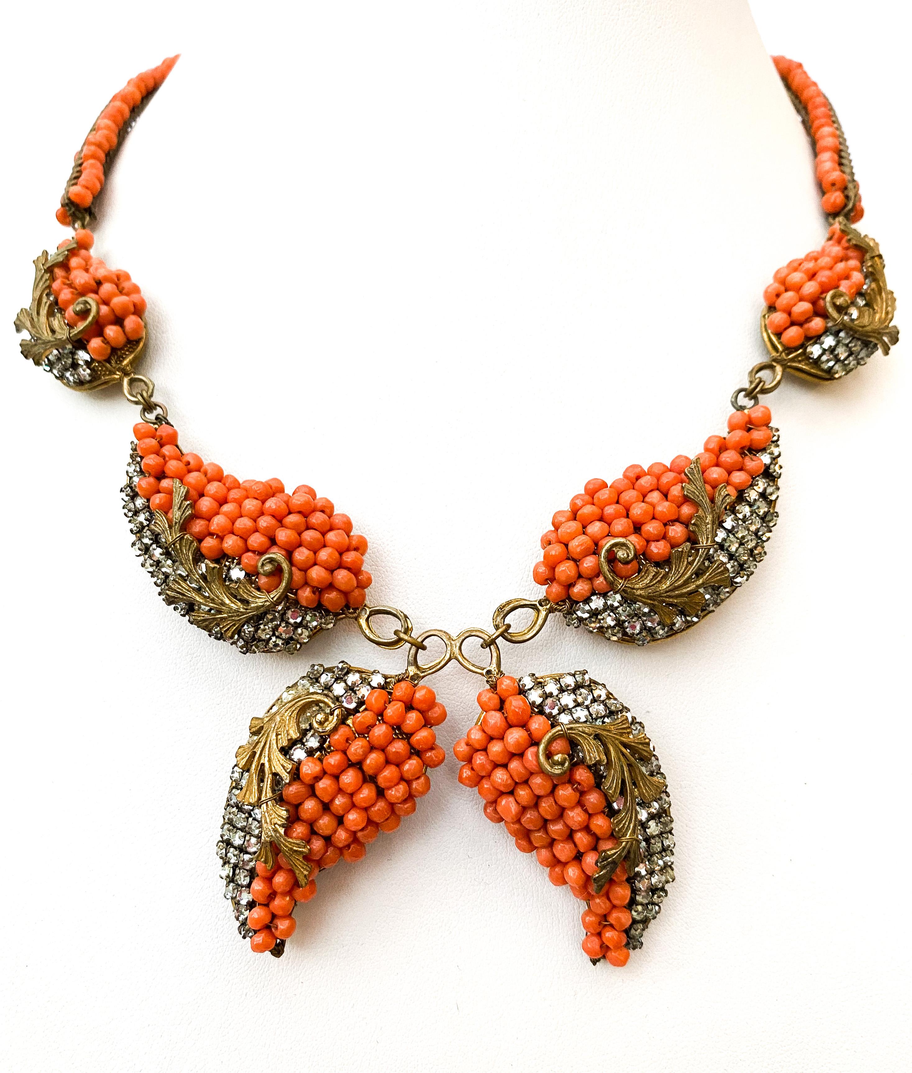 An early and very unusual three piece set (or parure) by Miriam Haskell. Designed by the most cherished of house designers, Frank Hess, it is a subtle mix of soft coral beads and 'rose montes' (clear paste stones), in a most original design, having