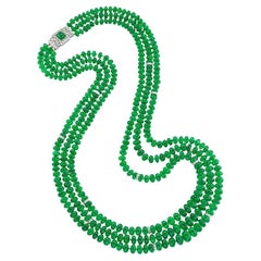 A Three-row Emerald Bead And Diamond Necklace