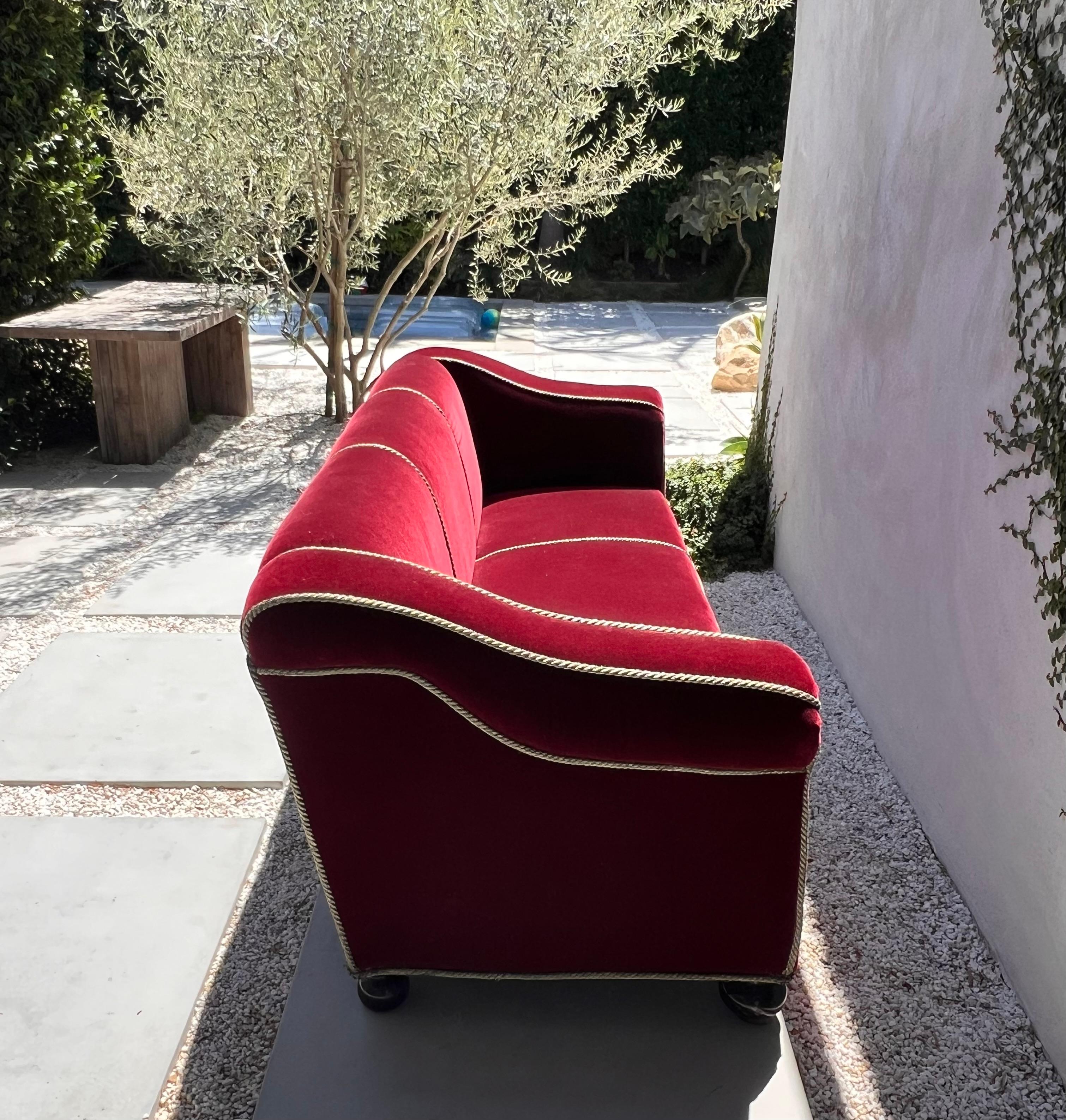 Beaux Arts A three seater sofa by Minton-Spidell in burgundy mohair, 20th century