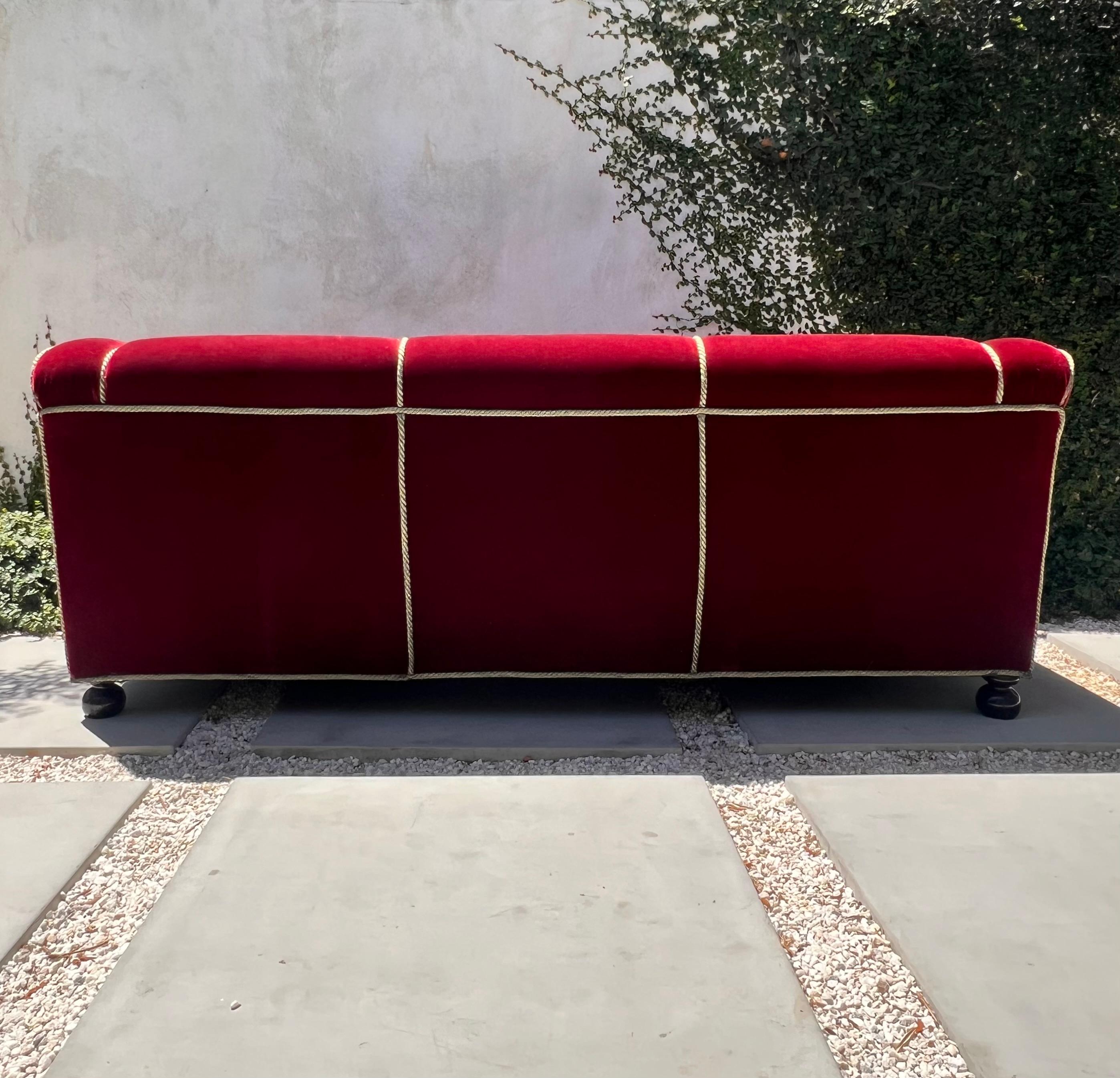 A three seater sofa by Minton-Spidell in burgundy mohair, 20th century 1