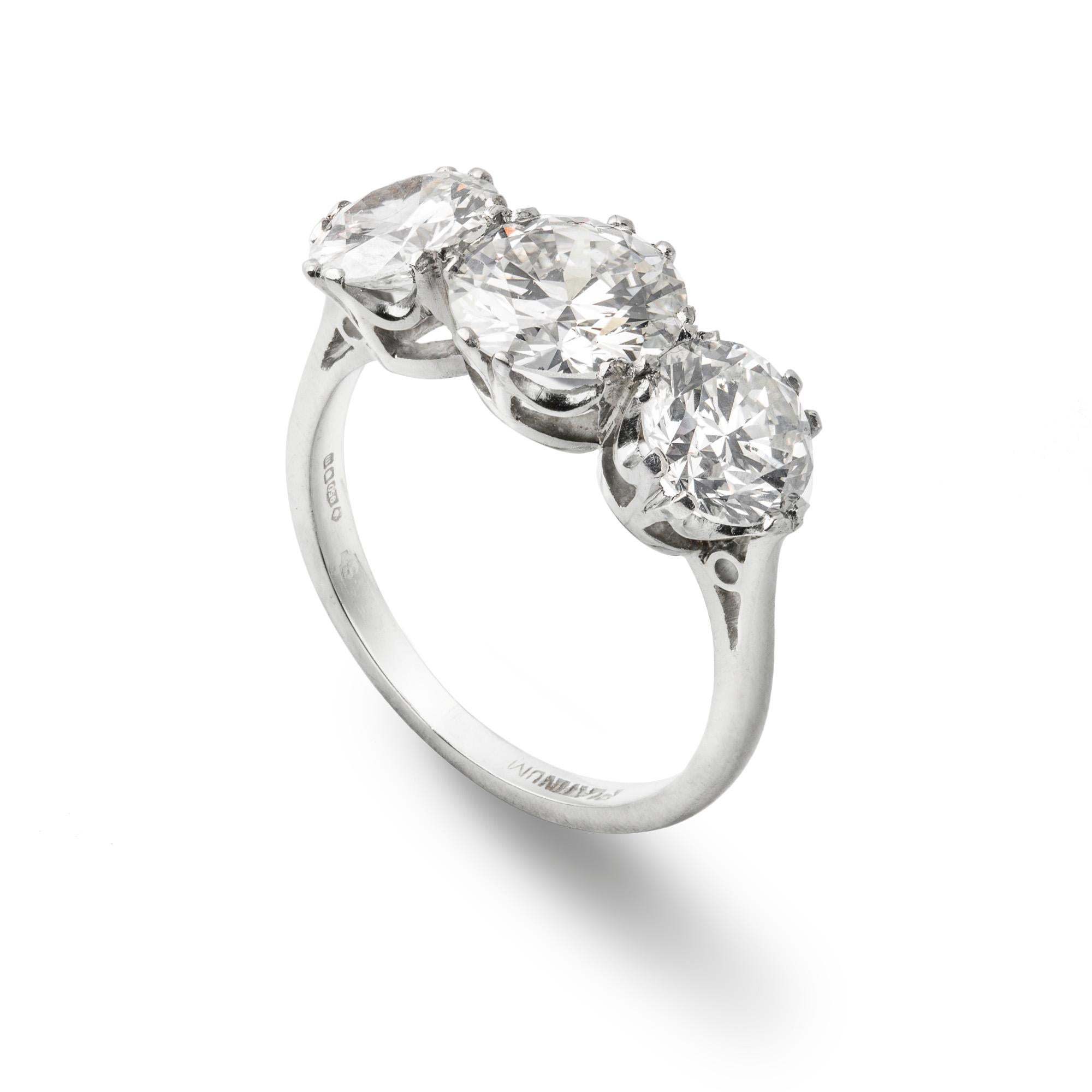A three stone diamond ring, the central brilliant-cut diamond weighing 1.34 carats J colour SI1 clarity, the two side stones weighing 0.92 carats H colour SI2 clarity and, 0.82 carats I colour VS2 clarity, accompanied by Anchor Certificates , all