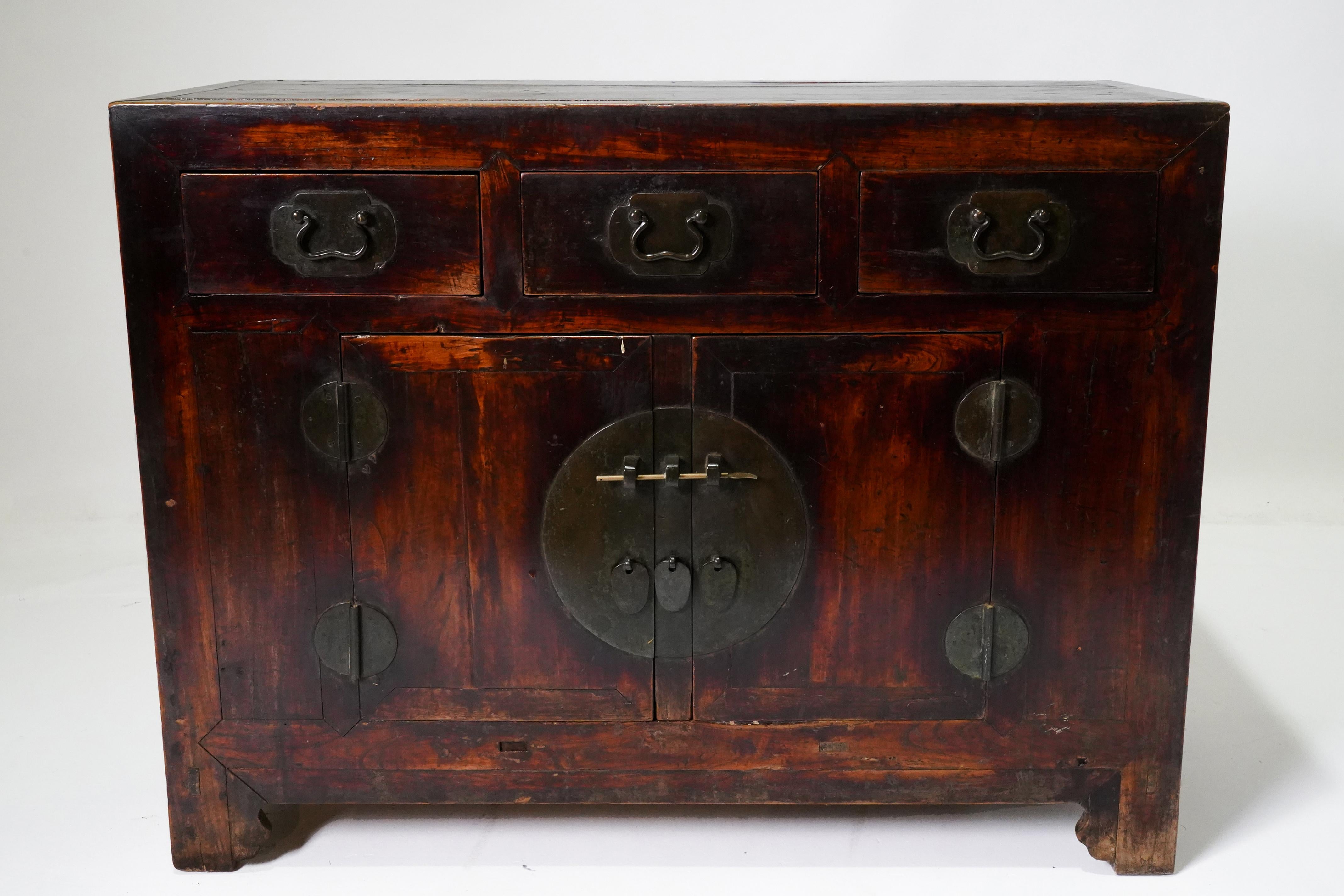 An exceptionally original 19th century household storage coffer in the Tianjin Style. Tianjin is a large city in Northeast China that acts as the port of Beijing. It was a prosperous city and the furniture made there was known for is solidity and