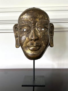 Tibetan Gilt Copper Alloy Mask on Display Stand