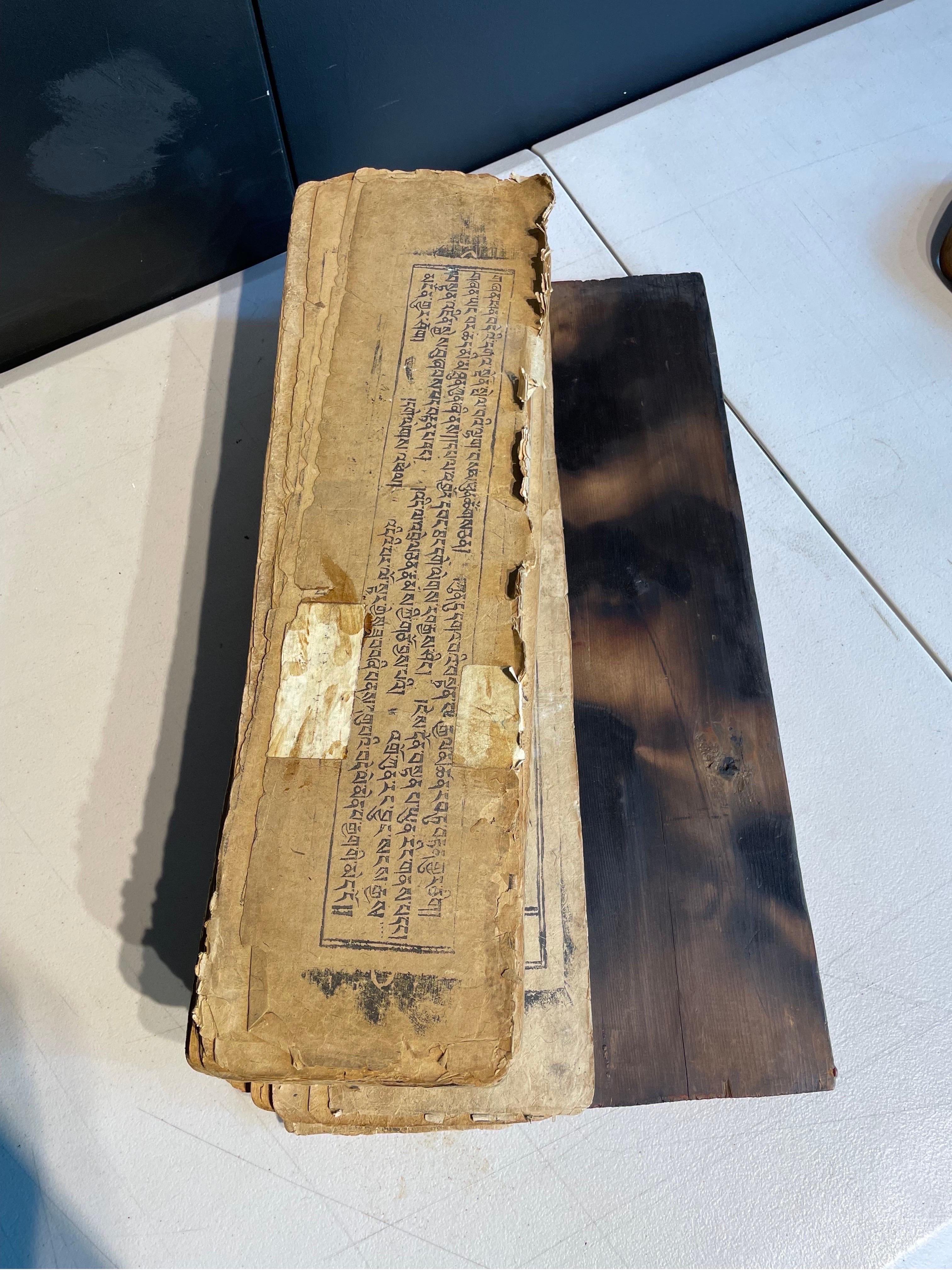 A Tibetan Prayer Book In Wooden Casing, 19th Century For Sale 3