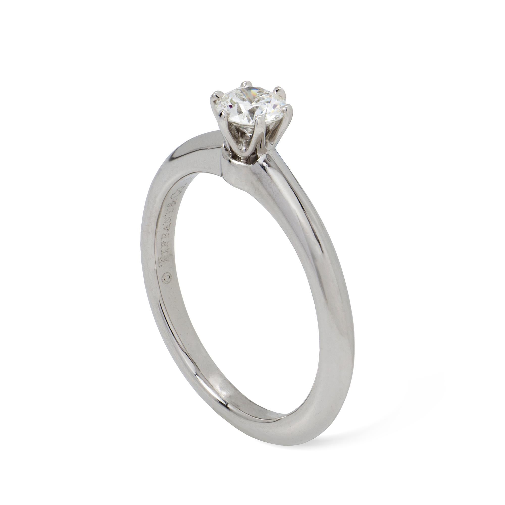 A Tiffany diamond solitaire ring, the round brilliant-cut diamond weighing 0.26 carats, assesed as G colour and VS1 clarity, claw-set to a platinum mount, signed Tiffany, inventory number 24991911, hallmarked platinum 950, London 2009,  finger size