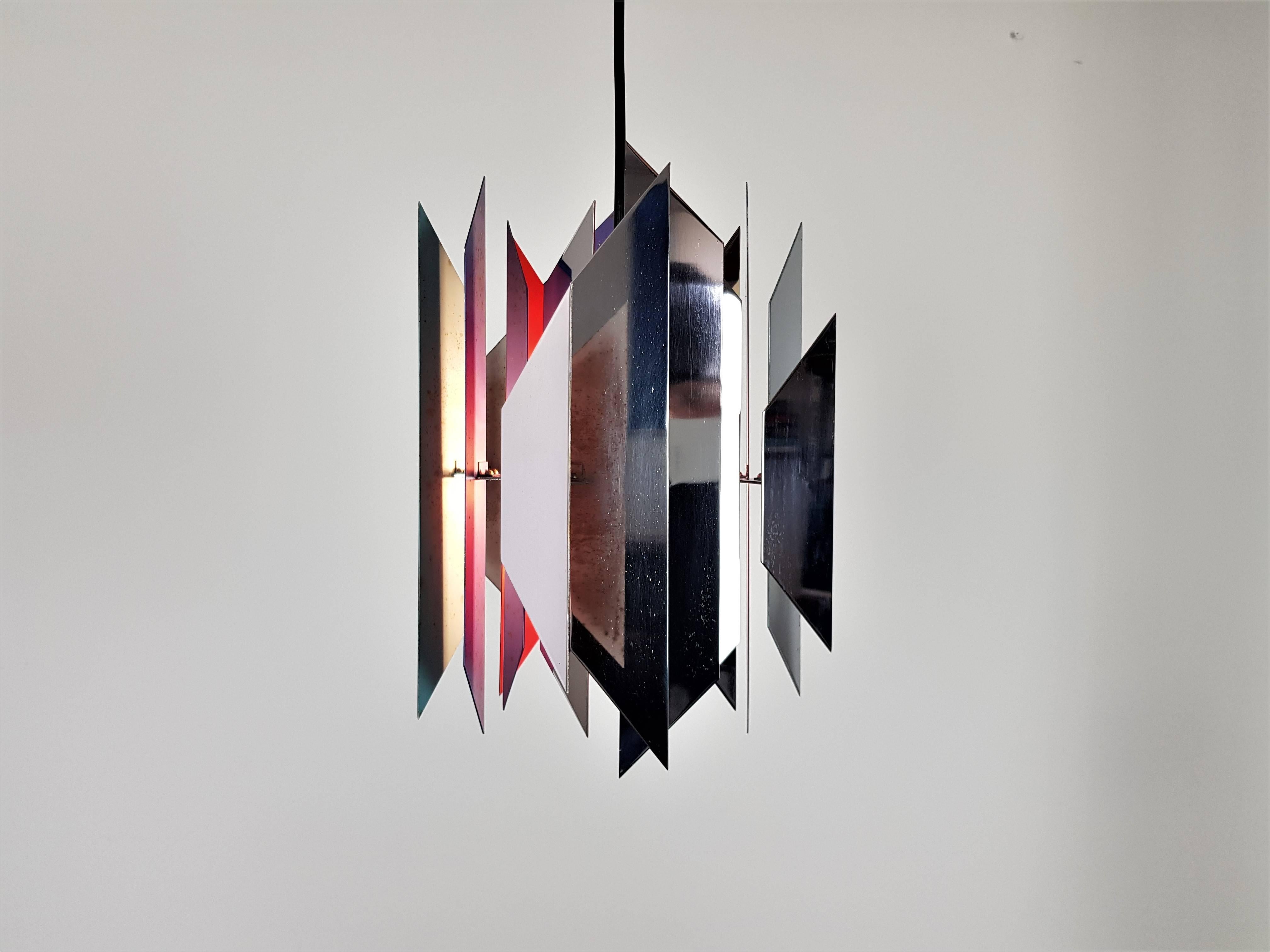 A 'Tivoli', also known as 'Divan 2' pendant, designed by Simon Henningsen the son of Danish lighting master Poul Henningsen. The pendants were originally designed for the Tivoli Gardens restaurant Divan 2 in Copenhagen in 1962. It is the most famous