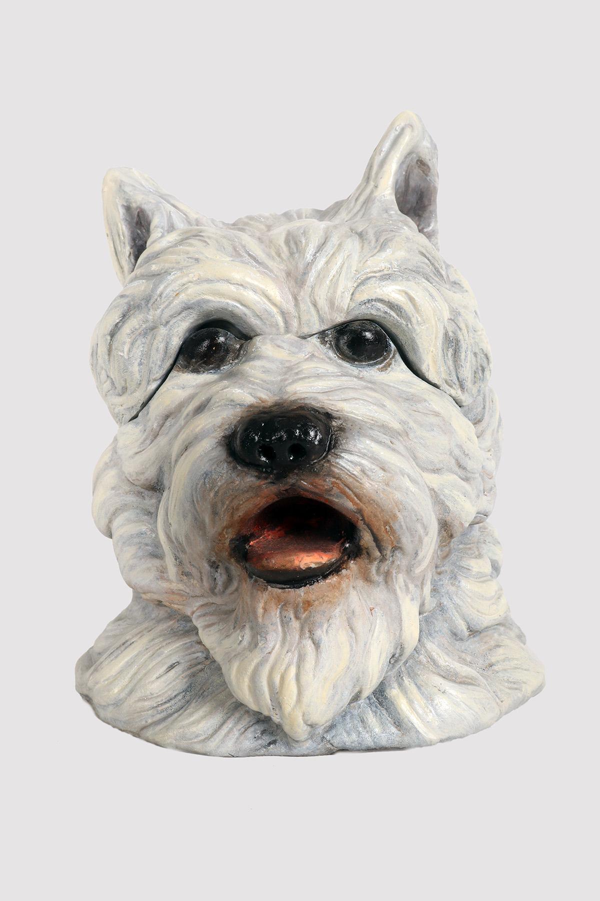 An unusual tobacco container made of painted terracotta and depicting the West Highland terrier dog’s head. The top opens revealing the container. Austria late 1800s - early 1900s.