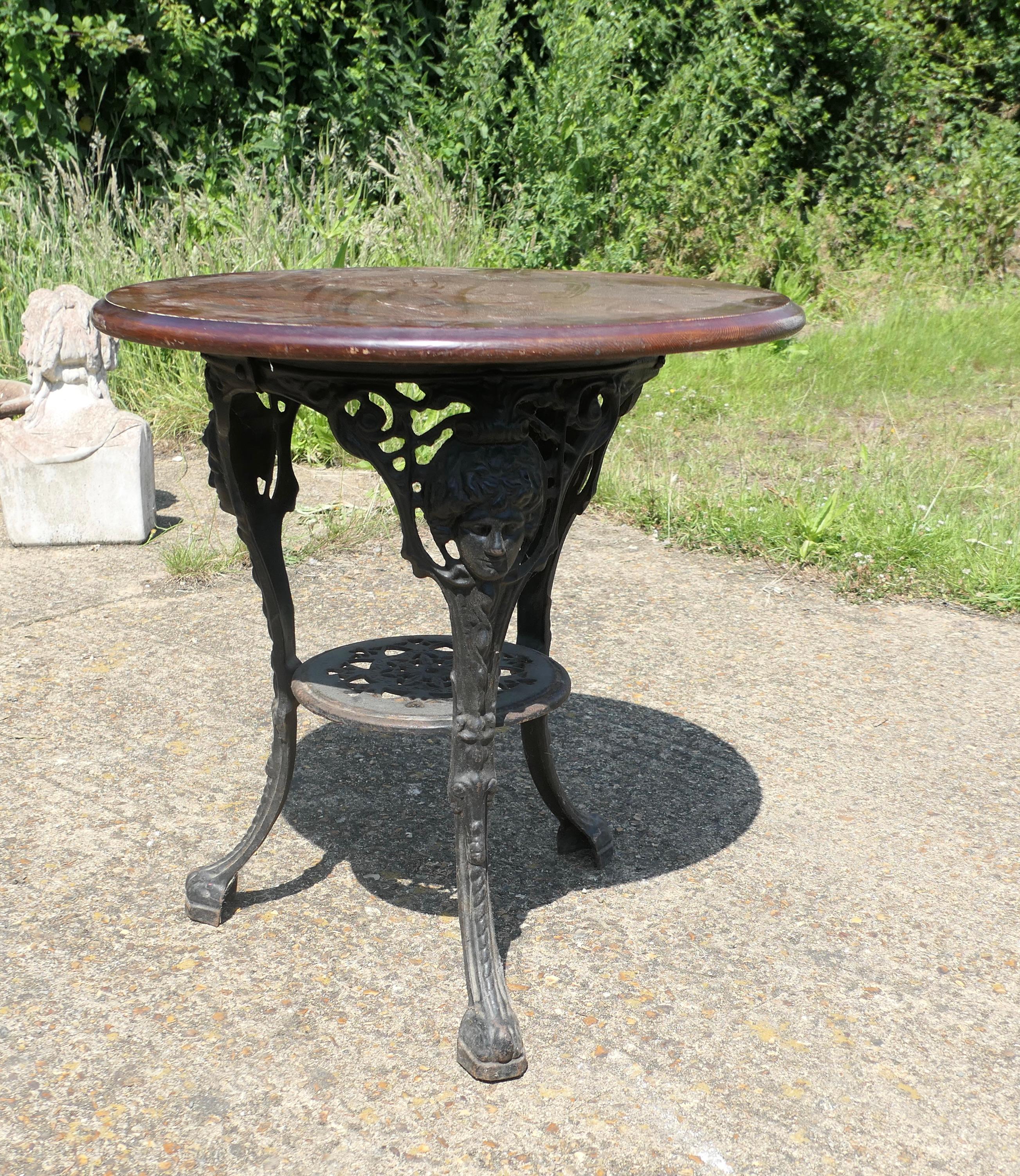 A Traditional Britannia Pub Table  
This is a traditional English Pub Table with the Britannia face on all 3 legs, the table is made in Cast iron it is in good sound condition, this one has a round Oak Top
We have several of these types of table