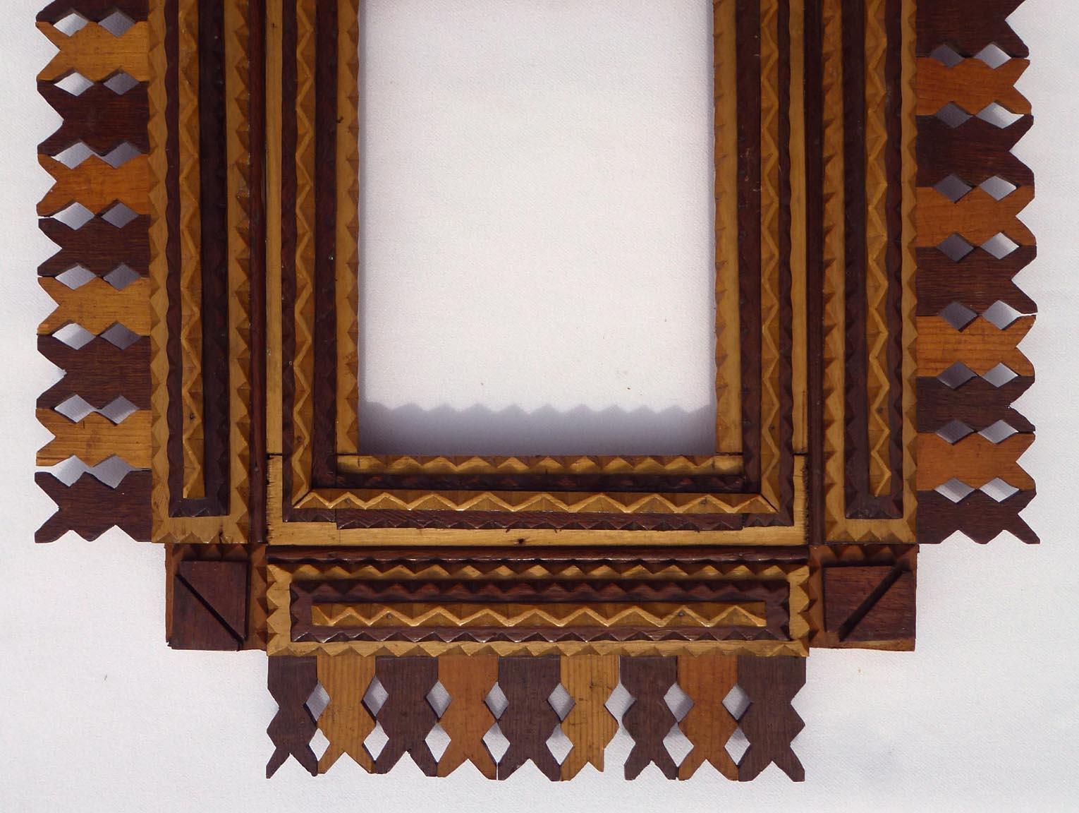 Mid-20th Century Tramp Art Frame with a Design of Light and Dark Woods, Pieced Openwork Border
