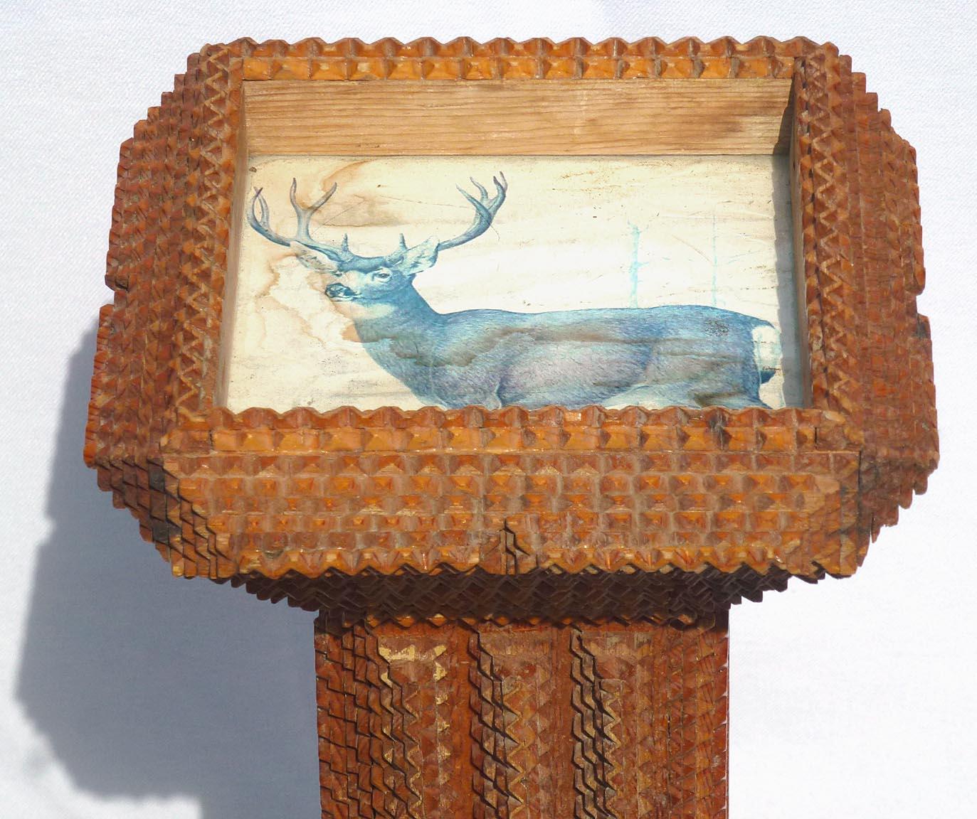Hand-Carved Tramp Art Pedestal Stand with a Print of a Stag Set under Glass in the Top