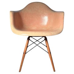 A Transitional Charles Eames PAW Shell Swivel Chair w Wood Dowel Legs