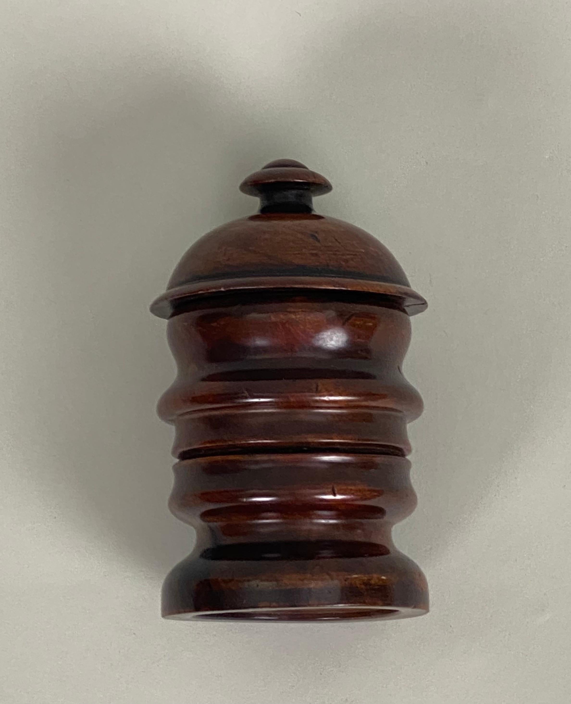 A rare turned treen tobacco jar, after a 'Profilo Continuo' by Renato Bertelli of Mussolini's Head.