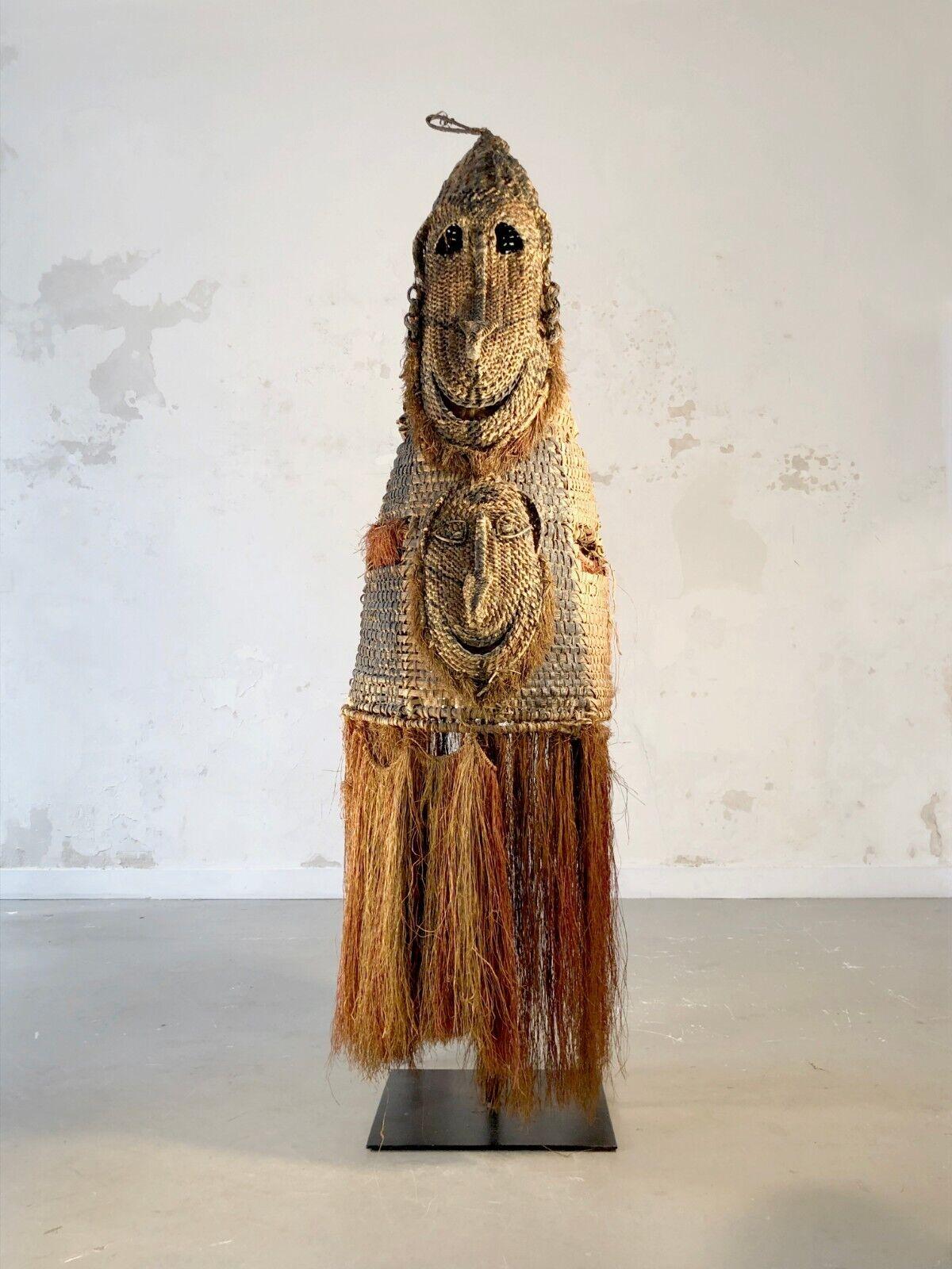 An exceptional, old and authentic, adornment or tunic or mask -full!- of Oceanian ceremony, with a double or split figure, on its very beautiful contemporary base in raw steel, Shamanic, Primitive Arts, Tribal Art, Brutalist, Shabby-Chic ,