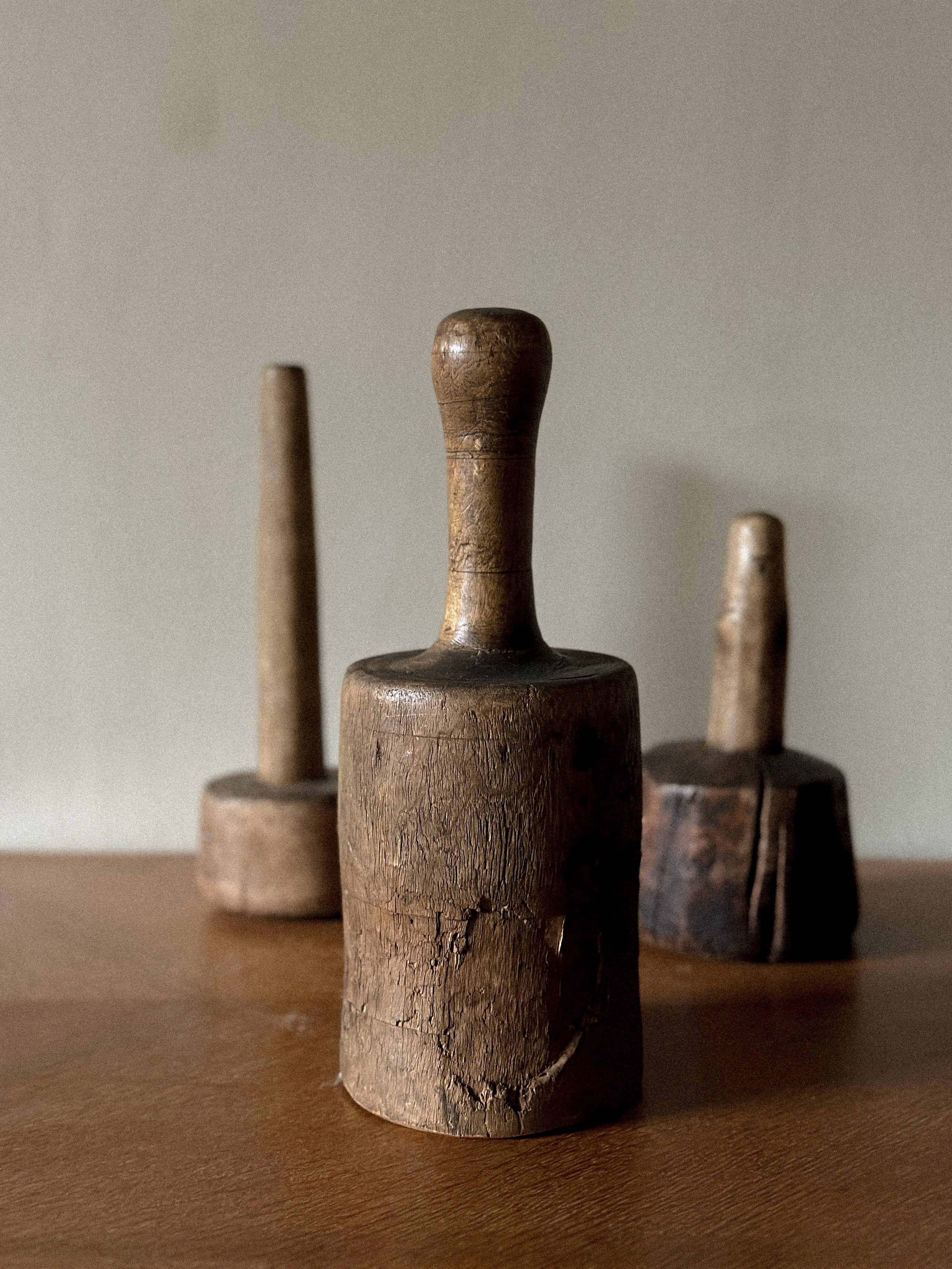 A Trio of Antique Wooden Pestles from 19th Century Scandinavia

Discover the essence of simplicity and beauty through our exquisite set of three Antique Wabi-Sabi Wooden Pestles, each whispering a tale of time and tradition from 19th century