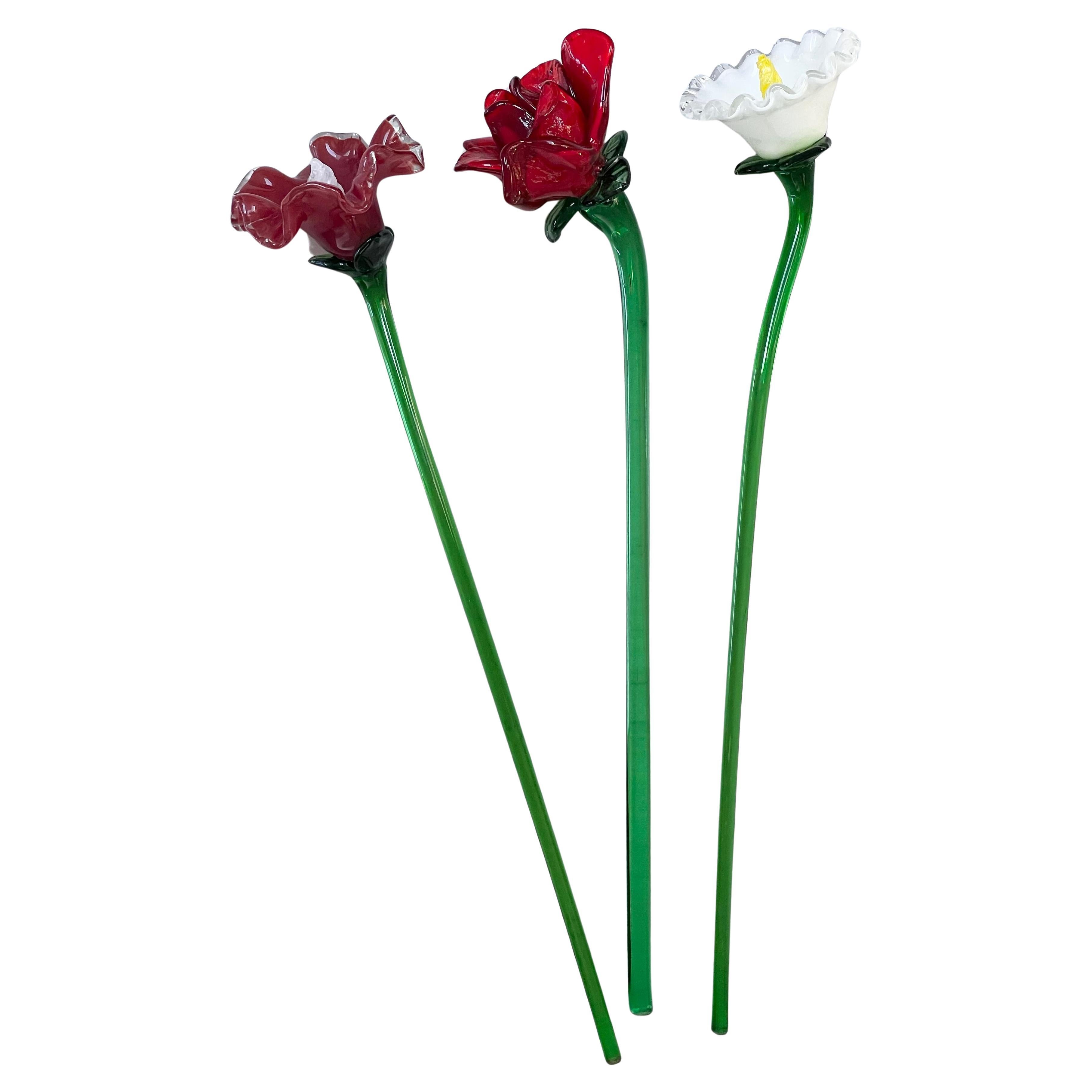 A trio of art glass flowers, late 20th century