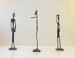 Trio di sculture africane allungate in bronzo, anni '70