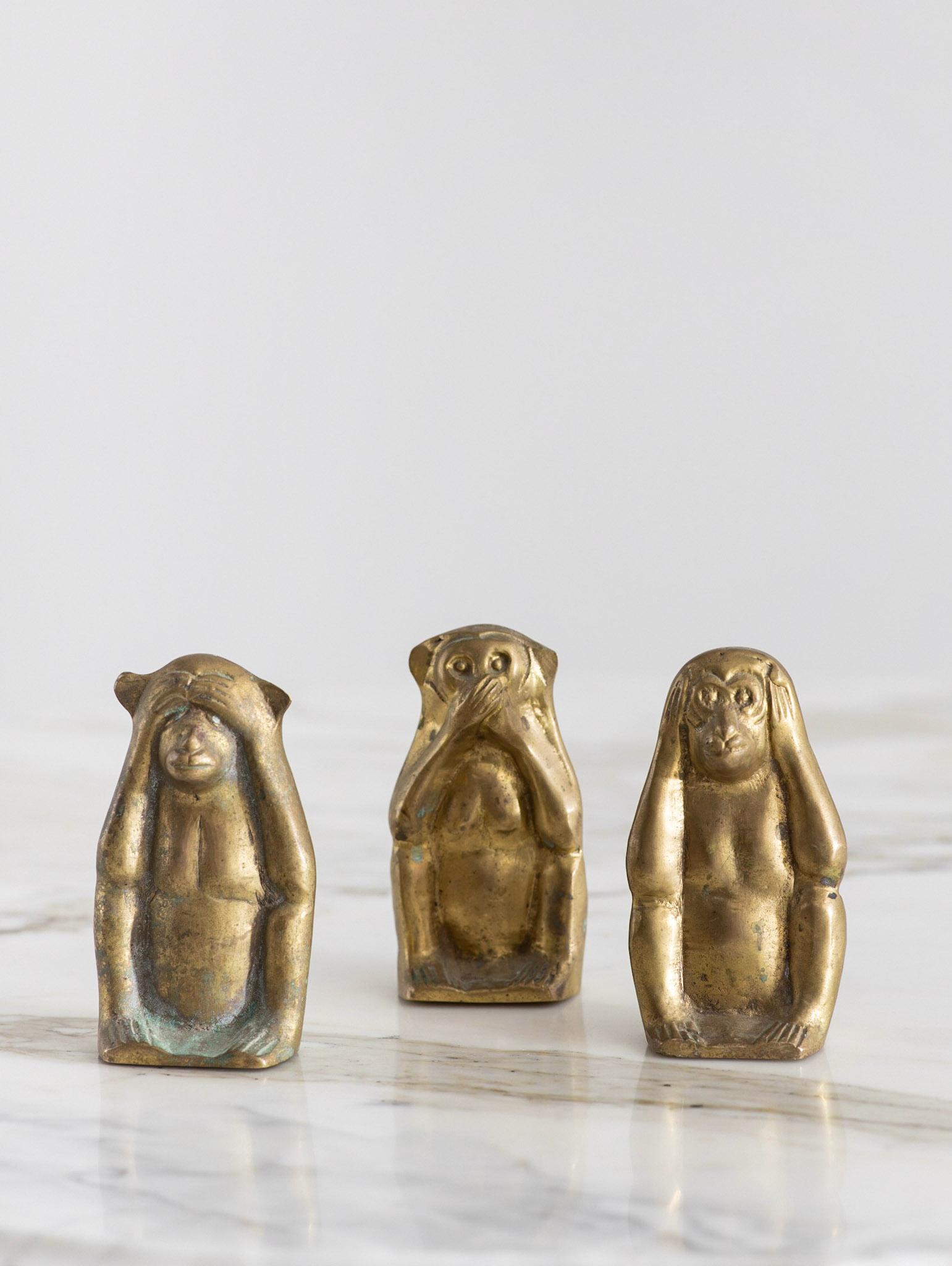 Three figural brass monkeys depicting the proverbial principle “See no evil, hear no evil, speak no evil.” Solid brass. A delightful decor piece or objet d’art. Measurements shown are of one individual monkey.