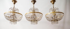A trio of smaller Sac and Perles chandeliers