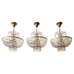 A trio of smaller Sac and Perles chandeliers