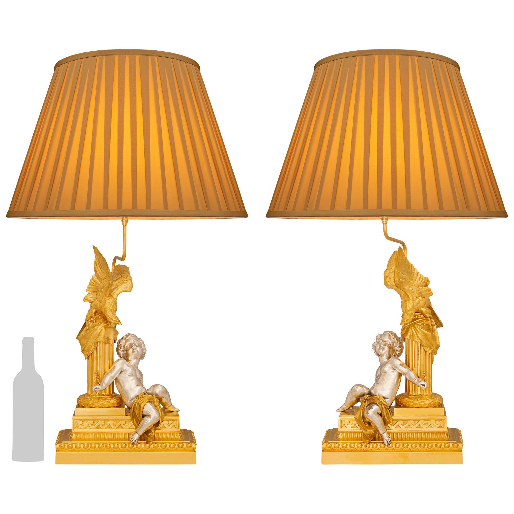 A true pair of French 19th century Louis XVI st Ormolu and Silvered Bronze lamps In Good Condition For Sale In West Palm Beach, FL