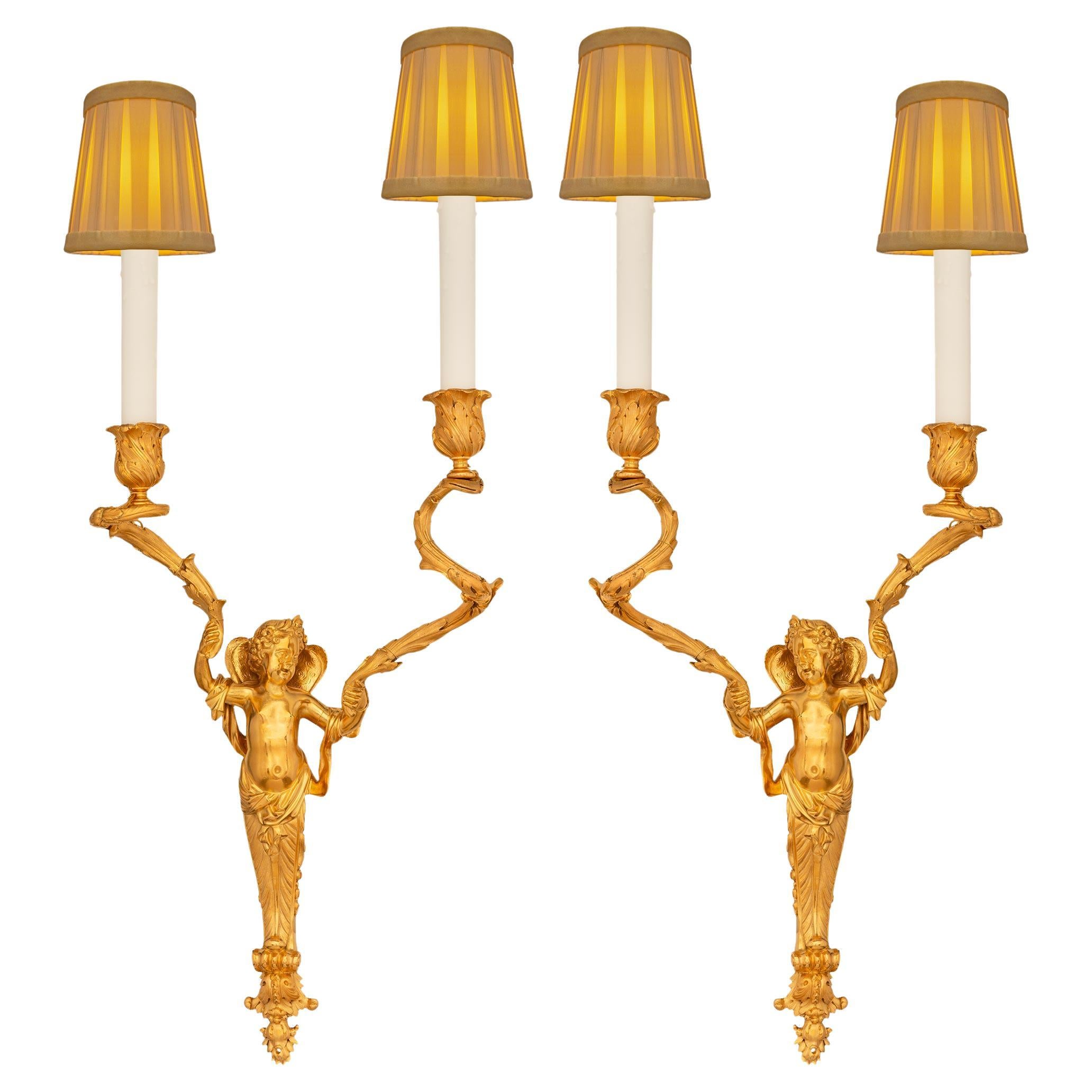 A true pair of French 19th century Louis XVI st. Ormolu sconces