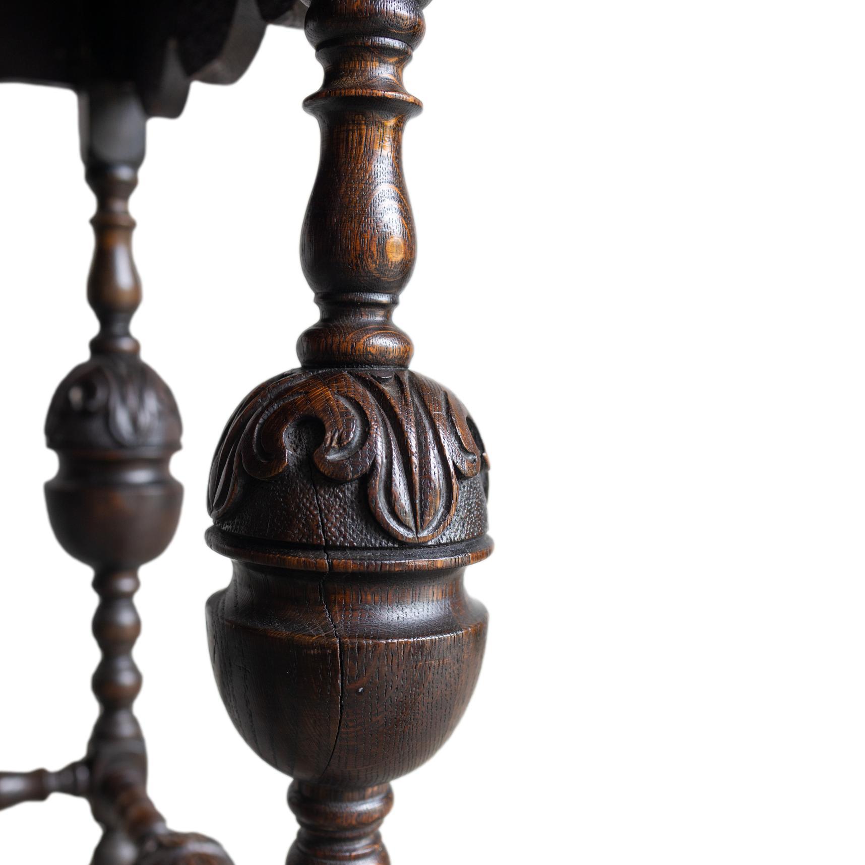 A Tudor-Style Carved Oak Center Table with Daisy Medallions, English, ca. 1880 For Sale 1