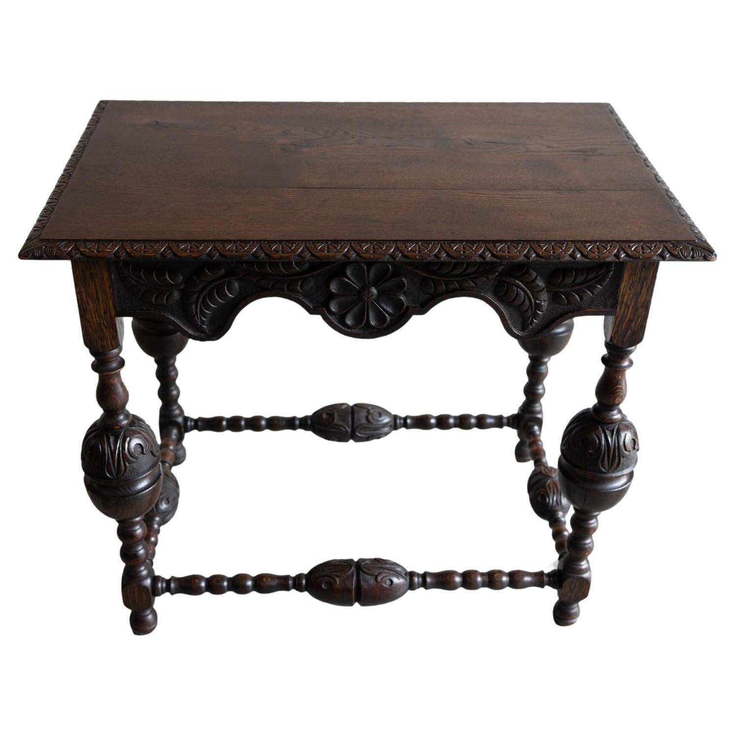A Tudor-Style Carved Oak Center Table with Daisy Medallions, English, ca. 1880 For Sale