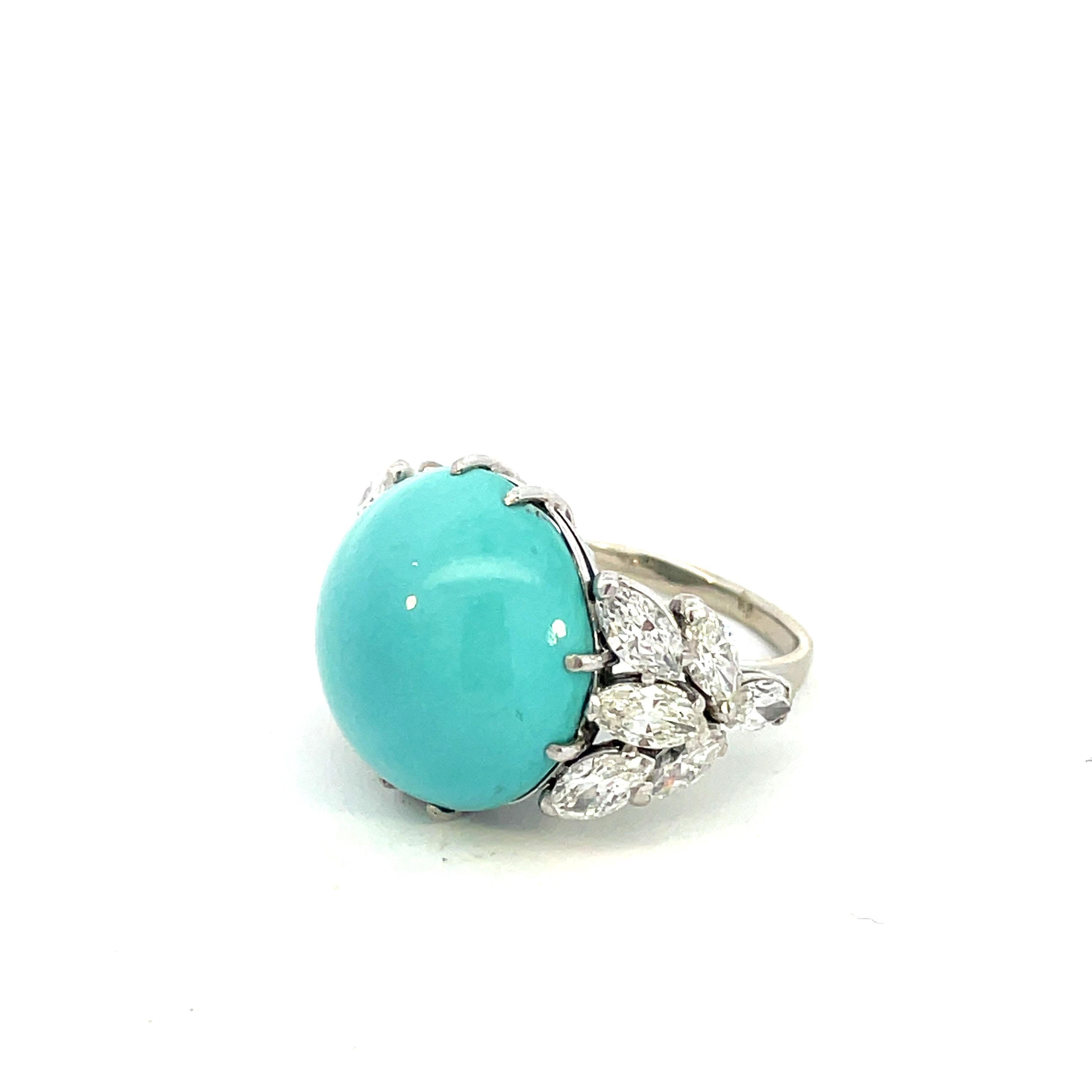 Very chic 1970's Vintage ring fancing  Navette diamonds and Natural Turquoise  round Cabochon.
The N 12 large Navette cut side diamond altogheter weighting about 2,4 carats G-H color VVs/Vs clarity
The Natural Turquoise has a beautiful color and