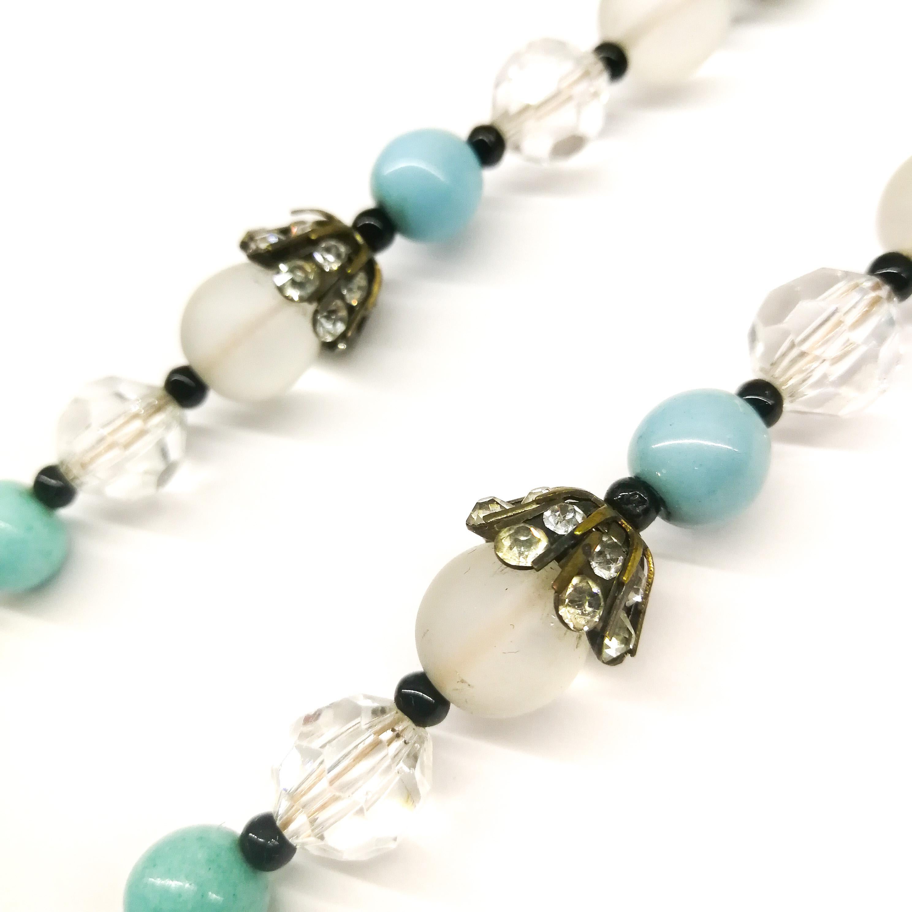 Bead A turquoise and frosted bead, clear crystal and paste sautoir necklace, 1920s For Sale