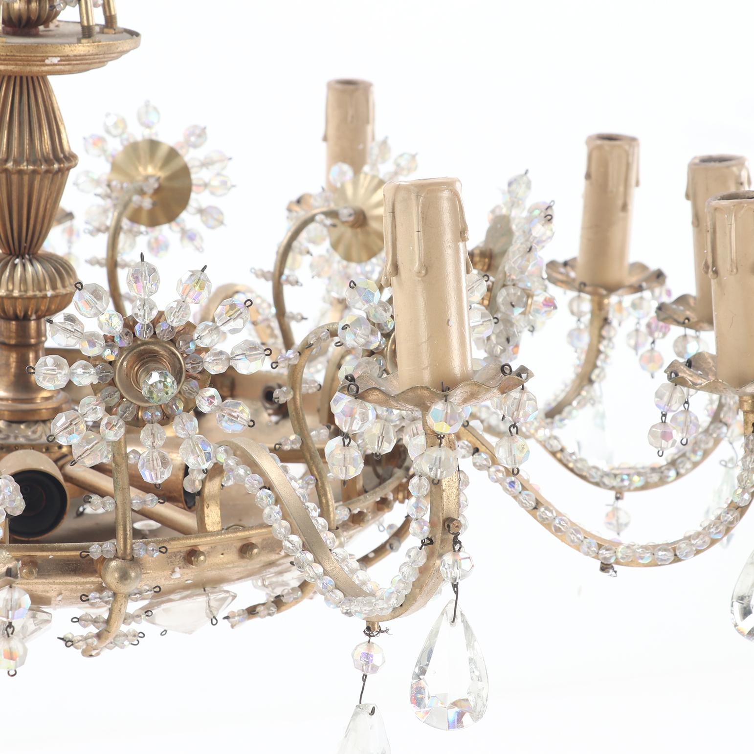 A twelve arm brass and glass beaded chandelier with amethyst beads circa 1950. In Good Condition For Sale In Philadelphia, PA