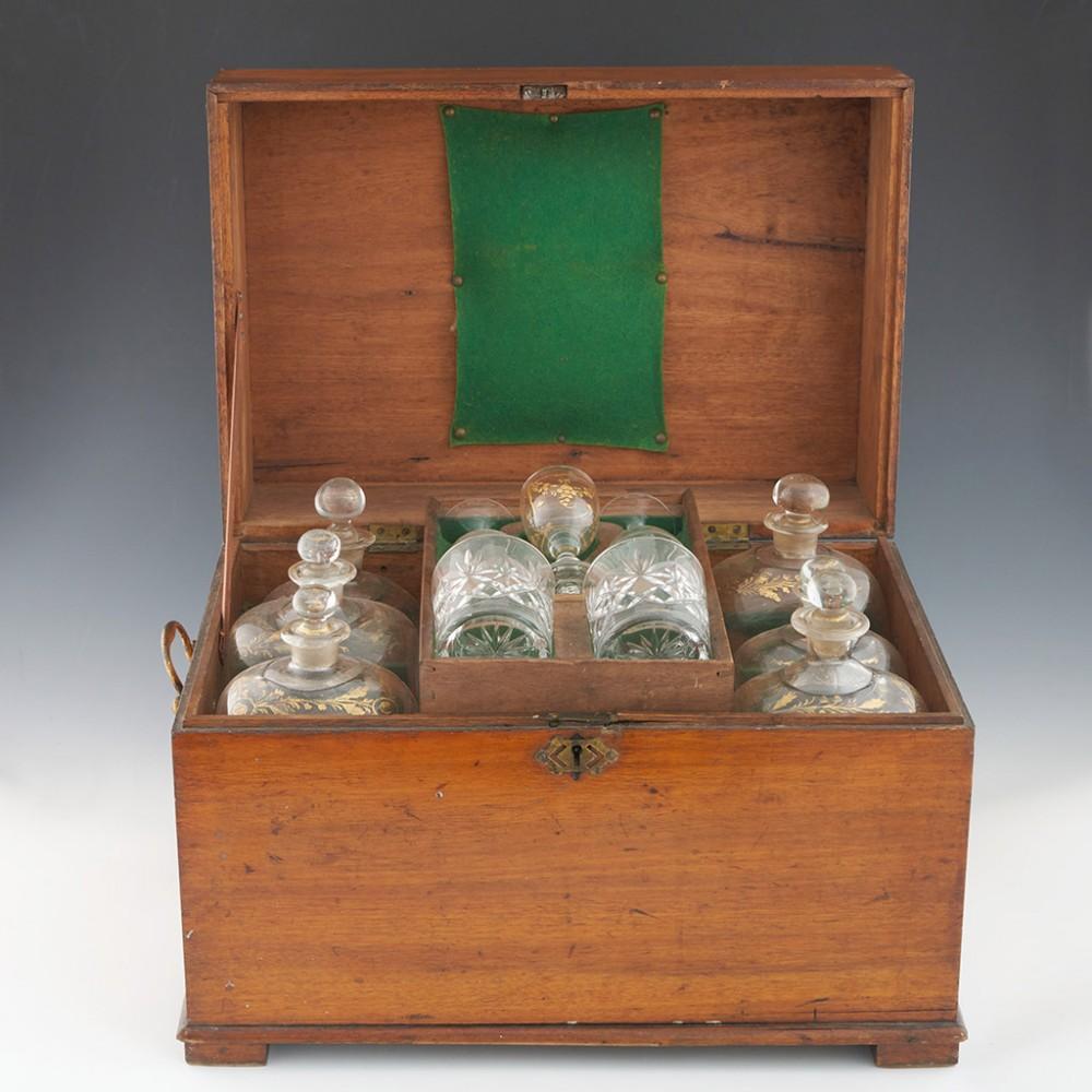 Heading : A Twelve bottle grog box 
Date : 19th century and later
Origin : The box is English, the bottles are probably French or Low Counrties
Glass Type : Lead-free  
Size : 29cm height, 44cm width, 29.5cm depth.
Condition : The box is also in