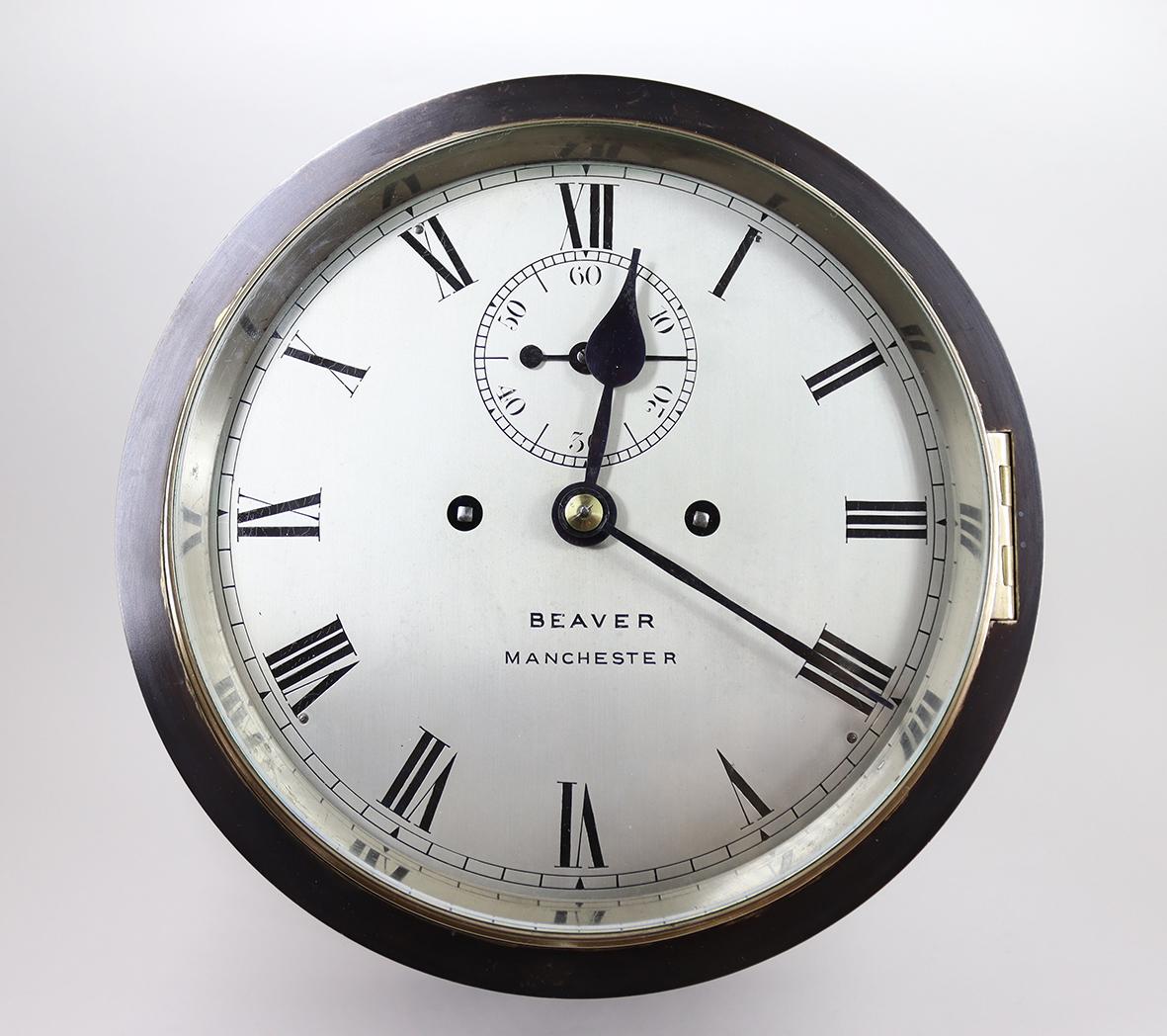 A fine ship’s bell bulkhead clock striking the ‘Dog Watches’ Sequence. This eight day twin fusee clock is a rare example of a ships striking clock marking the watches on board a ship.

The high quality movement regulated by a large gilded platform