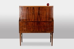 A two-drawer rosewood chest of drawers, designed as a writing desk. 1970s.