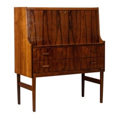 A two-drawer rosewood chest of drawers, designed as a writing desk. 1970s.