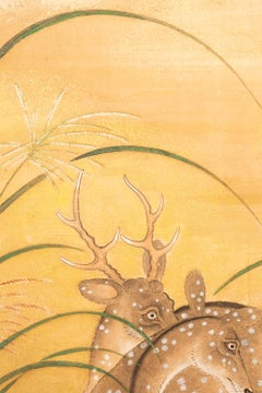 A two-panel folding screen with a pair of deer