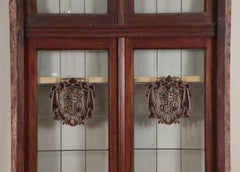 A two panel mahogany window set with leaded glass and frame, circa 1920.