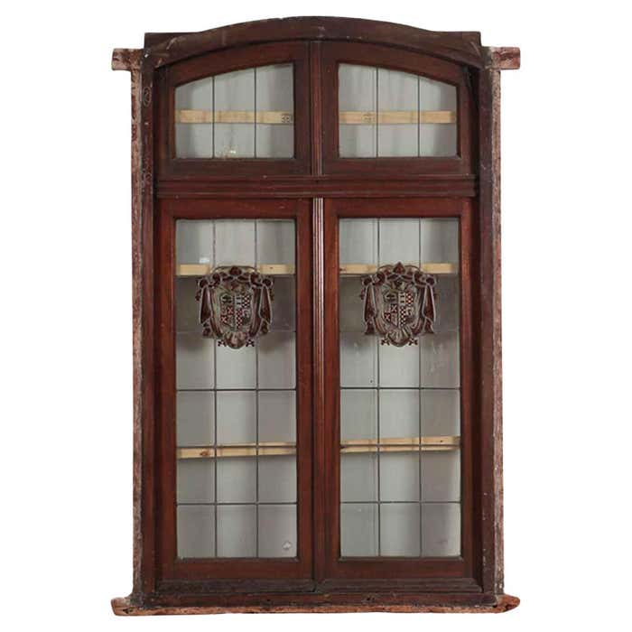A two panel mahogany window set with leaded glass and frame, circa 1920 ...