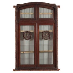 A two panel mahogany window set with leaded glass and frame, circa 1920.