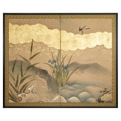 A two-panel screen depicting blooming irises and a sparrow