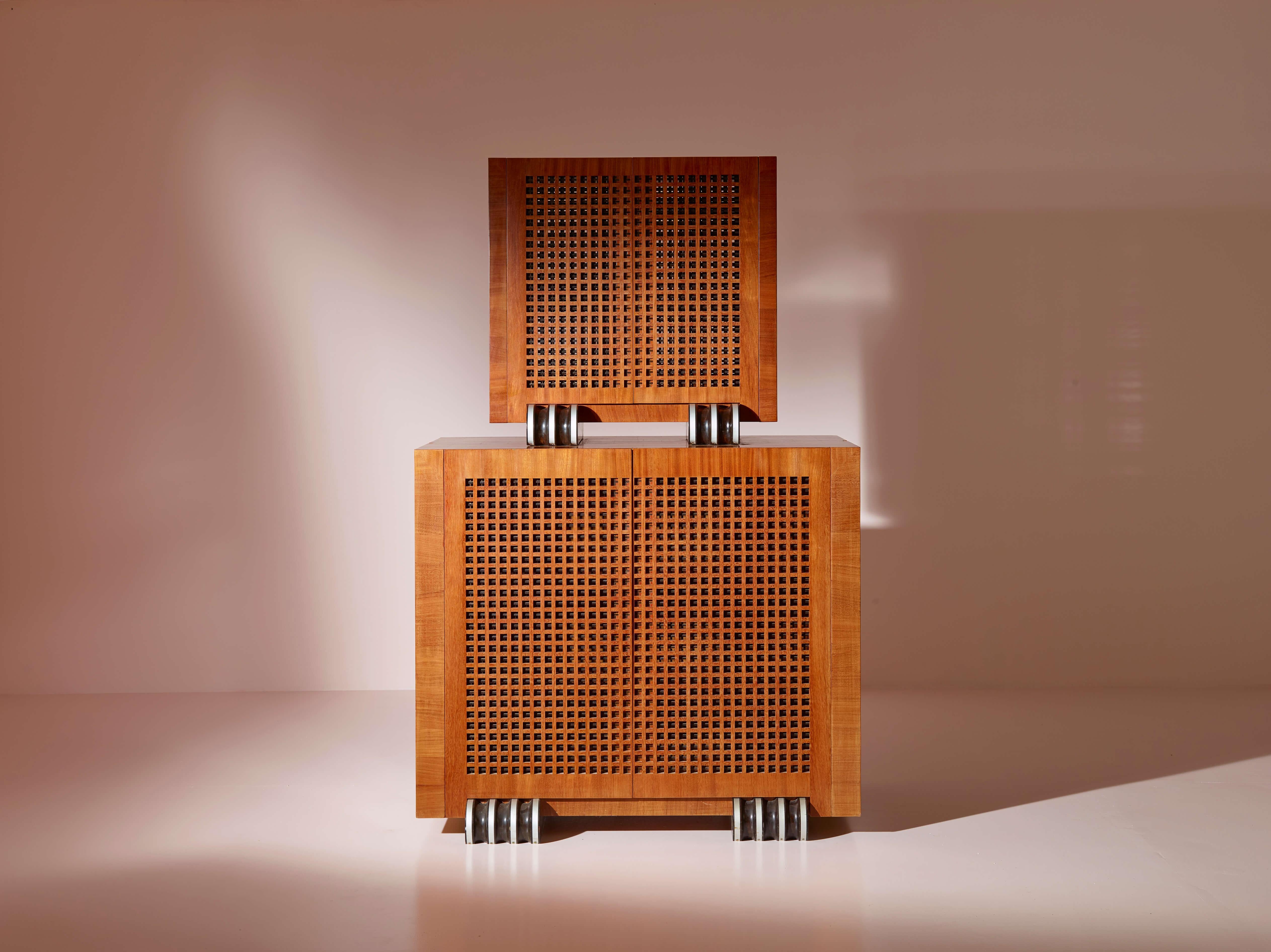 A large two-part cabinet in rare exotic woods with solid ebony inlays.

This unique two-part sideboard, crafted by Bottega Costa in the 1990s, is a remarkable example of Ligurian craftsmanship. It is not a prototype but a fully realized work, a