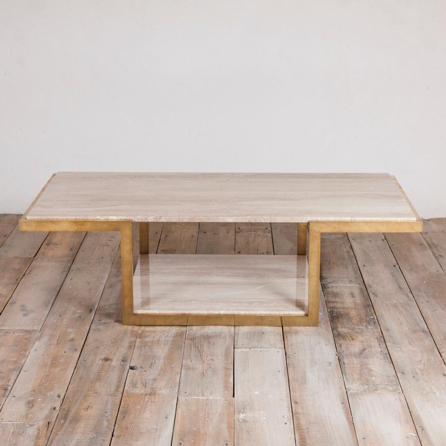 A 1970s two-tier brass and travertine coffee table.

Travertine is a terrestrial sedimentary rock, formed by the precipitation of carbonate minerals from solution in ground and surface waters, and/or geothermally heated hot-springs. It is often