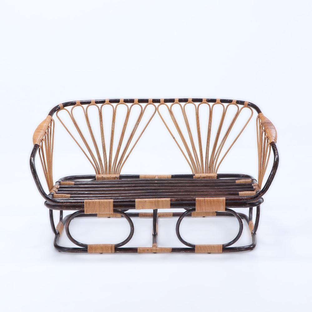 Mid-Century Modern A two-tone French rattan settee with cushions. Circa 1970