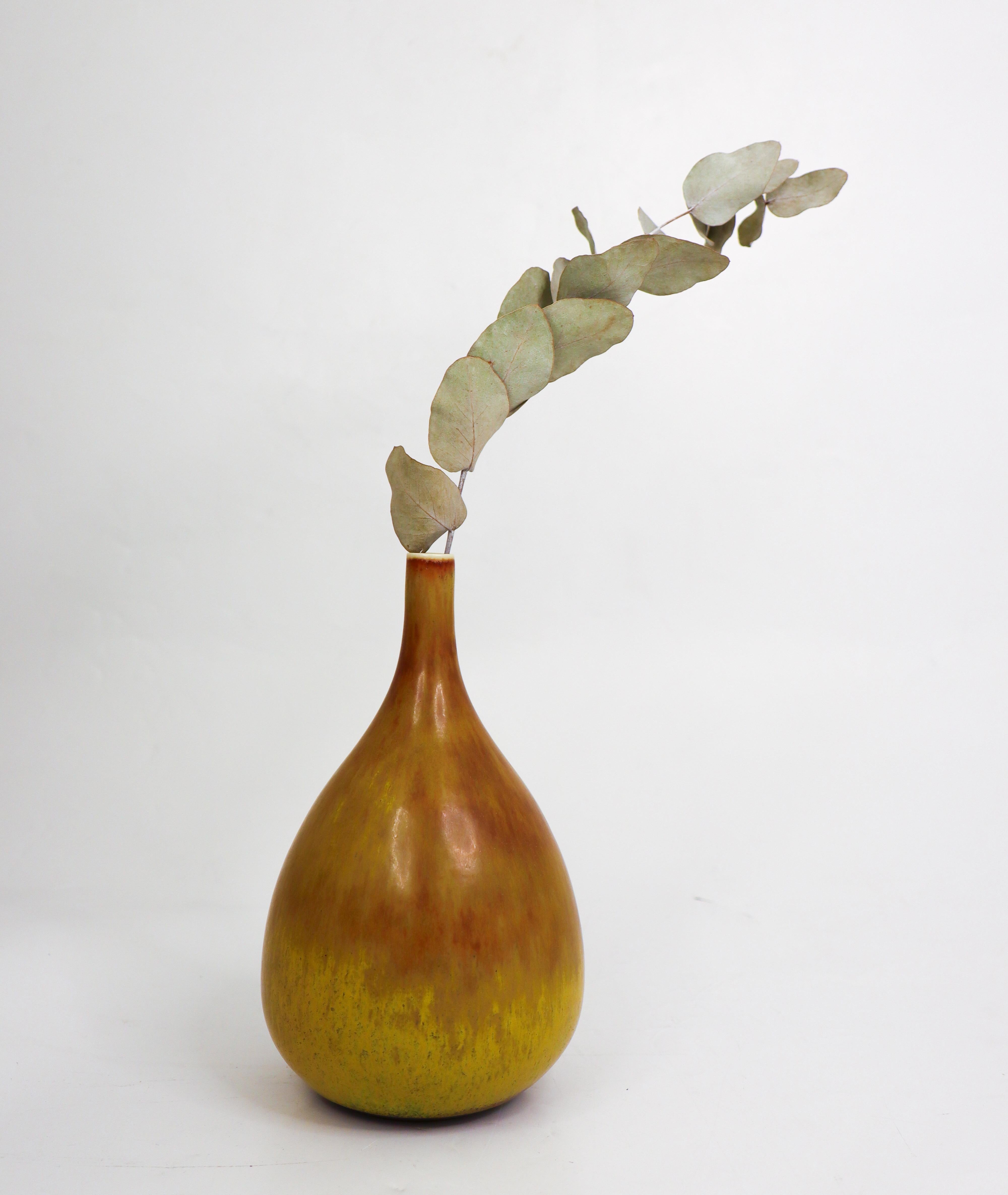 A unique brown and yellow vase designed by Carl-Harry Stålhane at Rörstrand. The vase is 19 cm (7.6