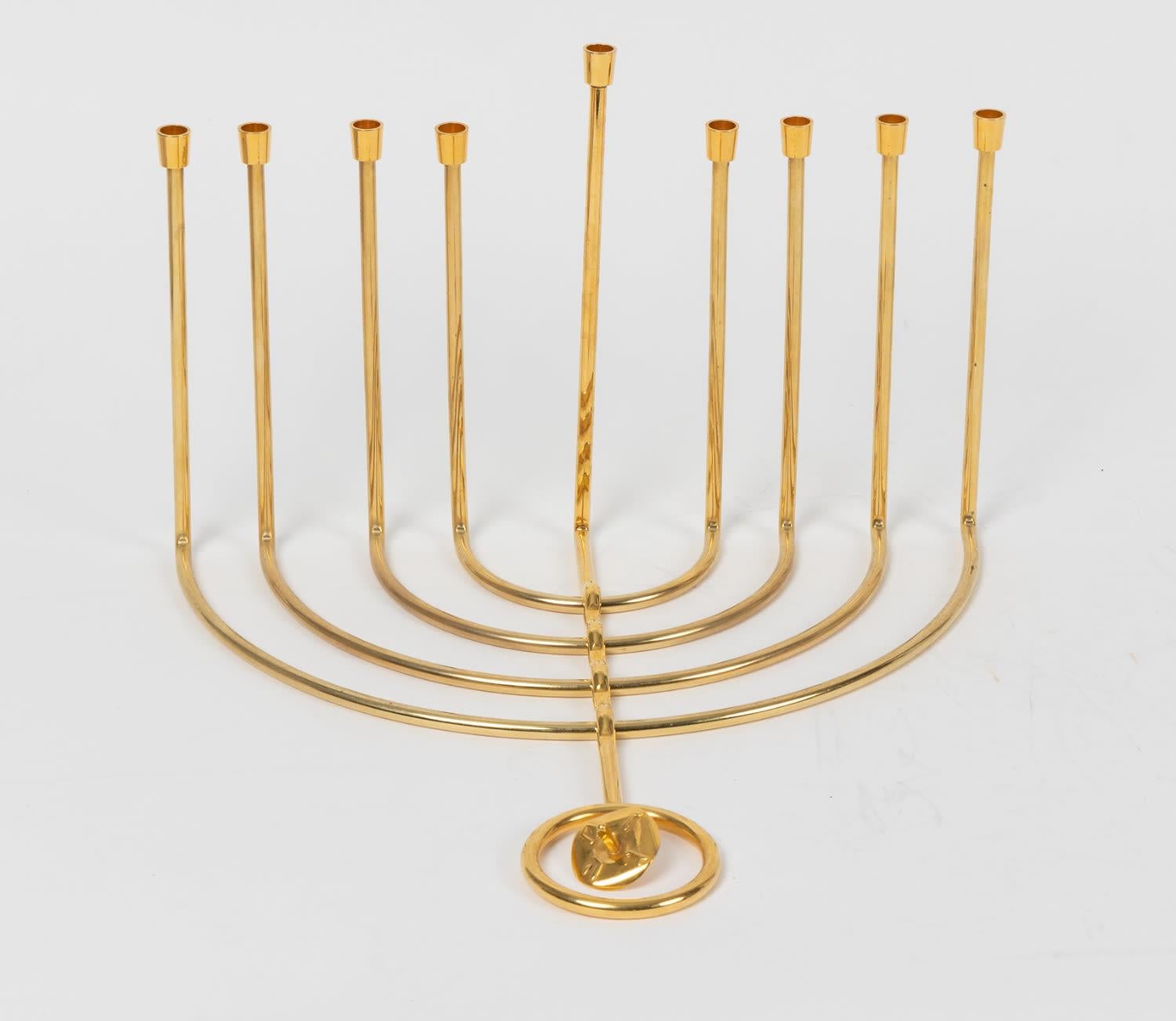 Modern Art: A Unique Chanukkiyah of gilt brass, by the Foremost Israeli Artist Moshe Zabari. Israel, 20th C.
Moshe Zabari, a foremost Israeli Judaica artist and graduate of the Bezalel Academy, was born in Jerusalem in 1935.



Zabari studied at the