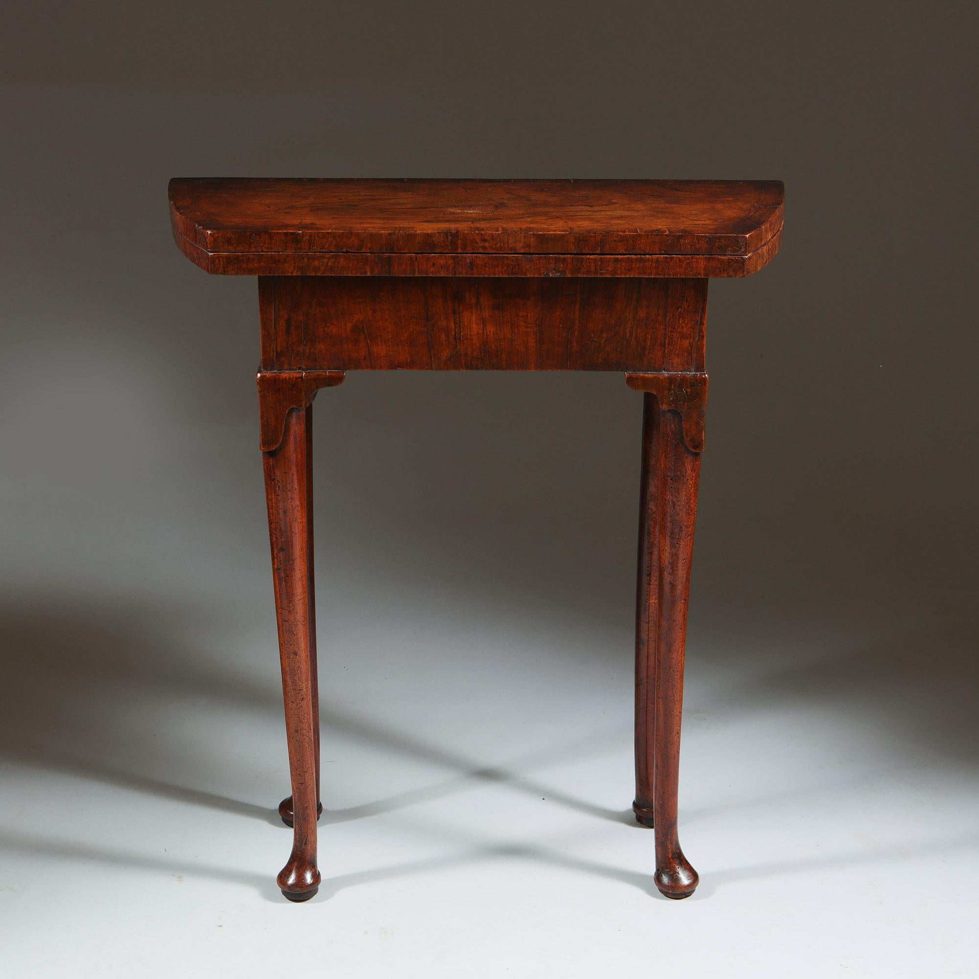 A Unique Early 18th Century Diminutive George I Figured Walnut Bachelors Table, Circa 1720-1730

The table is of very rare diminutive proportions raised on slender straight legs with what is known as lappet carved knees, terminating on pad feet. The