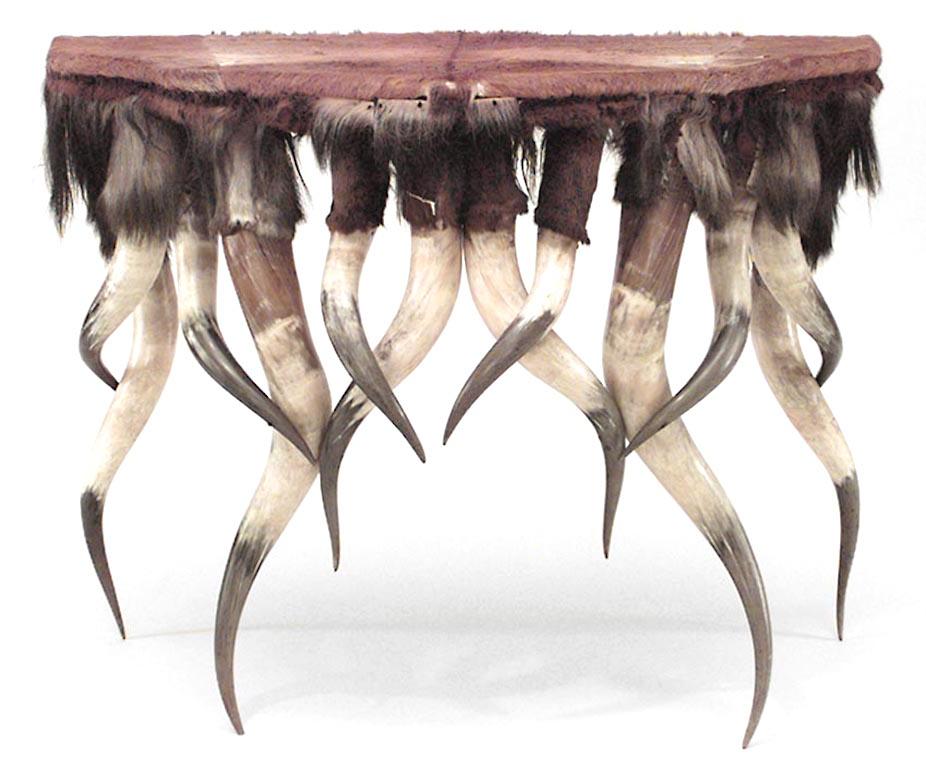 Rustic Continental (19th century) horn design shaped console table with animal skin veneer.
     
