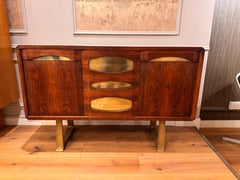 A unique Italian 2 doors and five drawers credenza with brass detailing