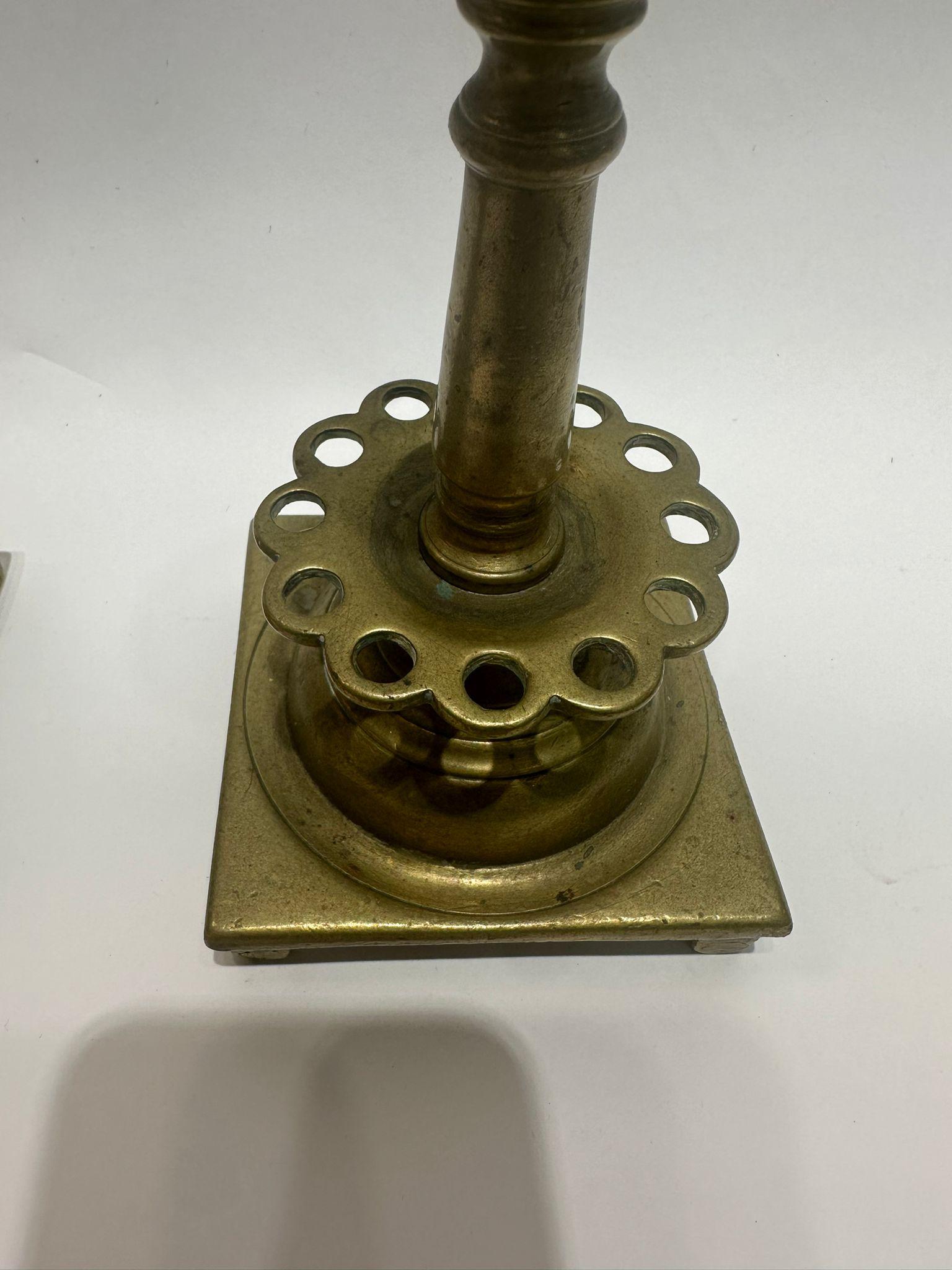 Cast A Unique Pair of 18th-Century Polish Brass Candle Holders For Sale