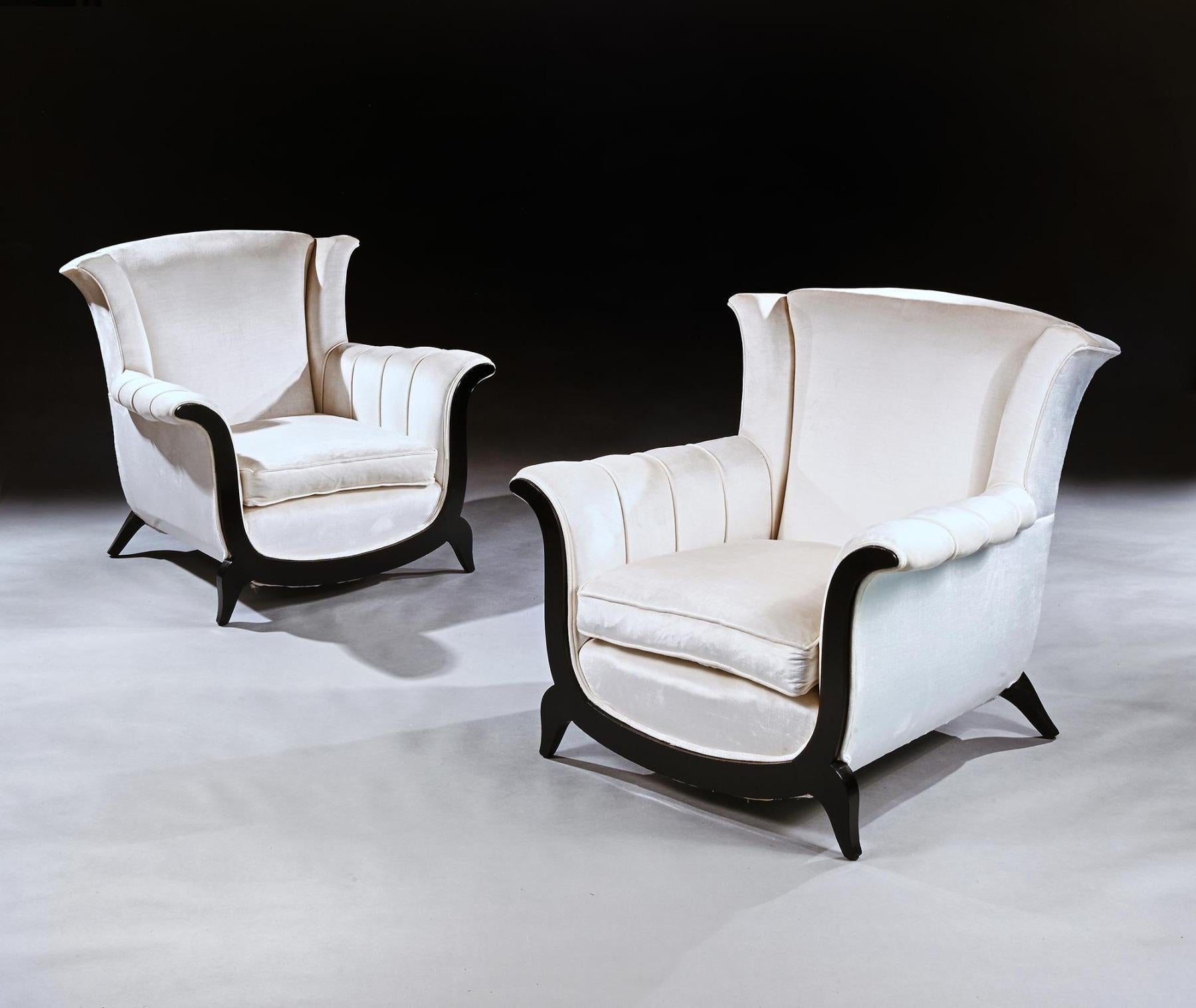 A very comfortable pair of Art Deco 20th century ebonised armchairs upholstered in an off white crushed velvet. 

French Circa 1930-40.



The design and shape of these chairs say it all, they have elegance and style.



Having a sprung