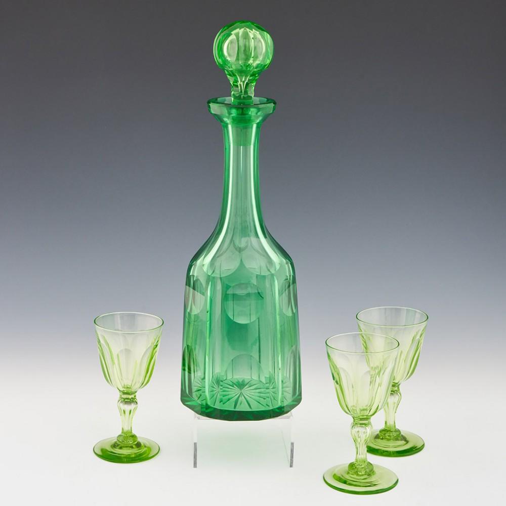 A Uranium Decanter with 3 Uranium Wine Glasses, circa 1845

The uranium decanter has a hollow lens cut ball stopper, slice cut neck, and lens cutting to the body. It is 35.5cm tall.

Additional information: 
Period : The decanter - c1860 and